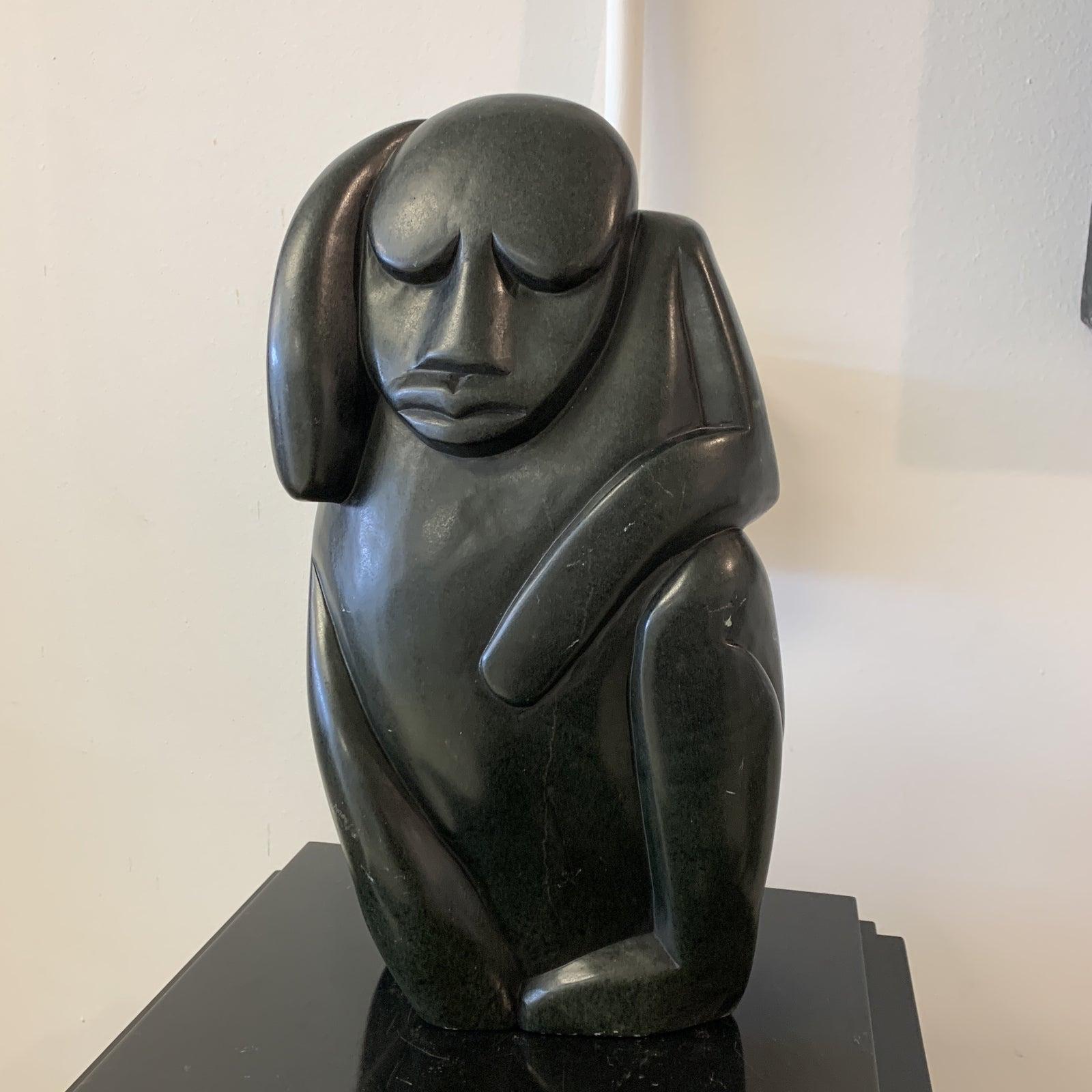 Peter Mandala signed Zimbabwean carved verdite stone sculpture. CONDITION: Areas with minor wear & scratches.
Peter Mandala (b. 1951) developed a distinctive style depicting a vast range of human expressions. He works primarily in Serpentine or