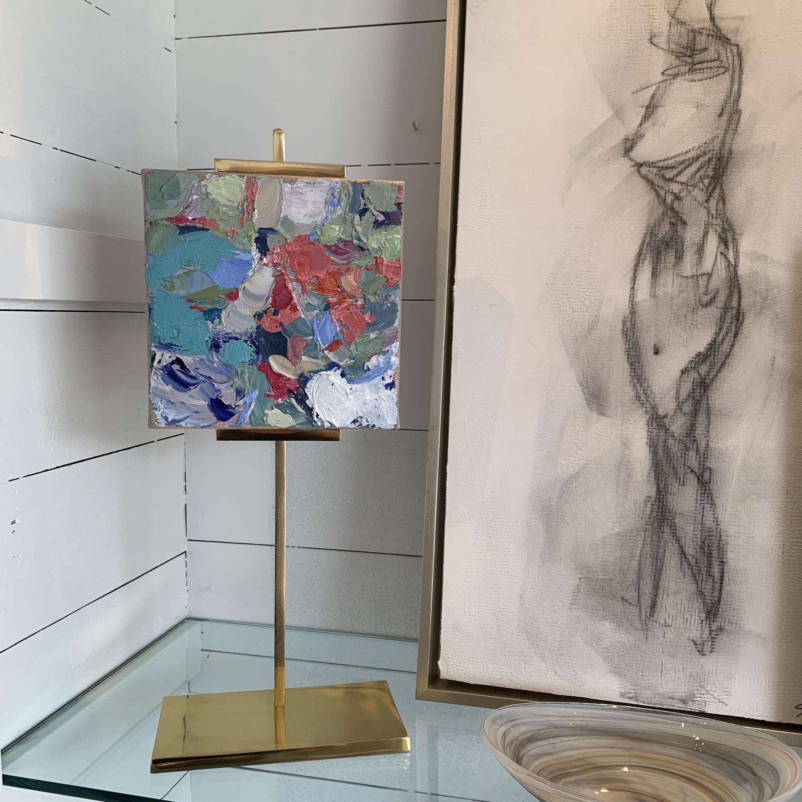 So hard to NOT purchase!! We call these irresitable art! Great for the bedside , console table , book case styling or any other surface! 
the oil painting is and 8 x 8 on adjustable gold easel by painter Stephanie Wheeler 