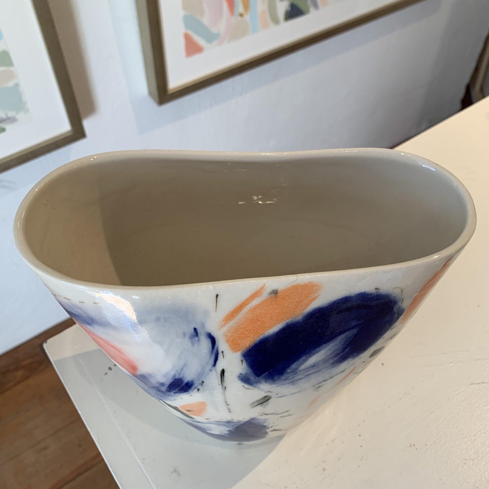 Hand painted vase by Stephanie Wheeler. Hand made and signed. Orange, navy and white.