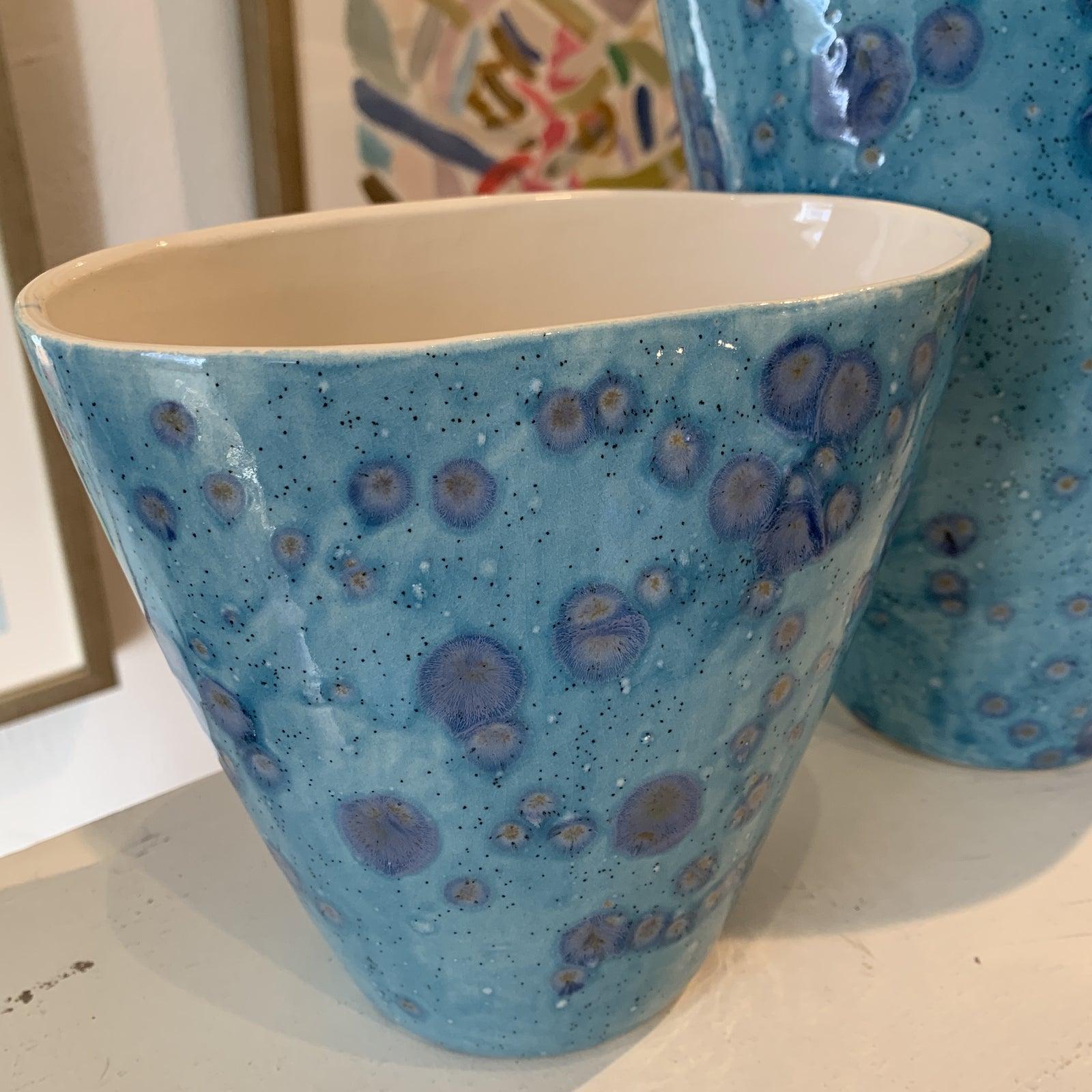 Pair of handmade blue and purple vases. Artist hand makes each piece in her Atlanta studio.
Somewhere between impressionism and abstraction, Stephanie Wheeler’s paintings take on a life of their own. She began her career in Atlanta as a classic