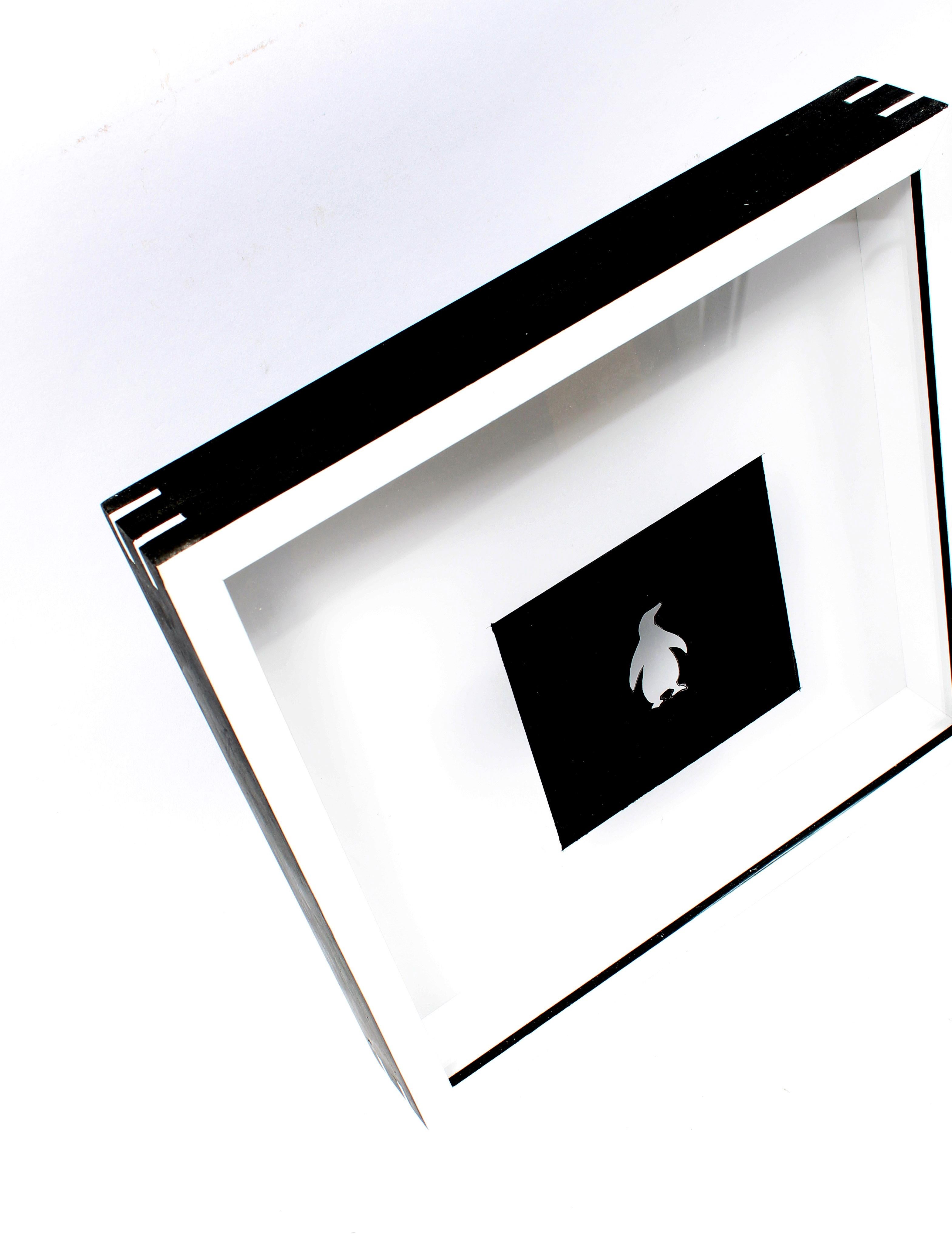 An original unique reverse painting of a Penguin by American contemporary artist Peter Bellomo.

This work comes framed in an archival shadowbox frame presentation.

The reverse painting creates a shadow on the backing of the frame which enhances a