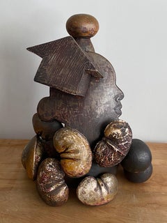 Mother Pin Provides: ceramic sculpture w/ figure, female profile, beans & house