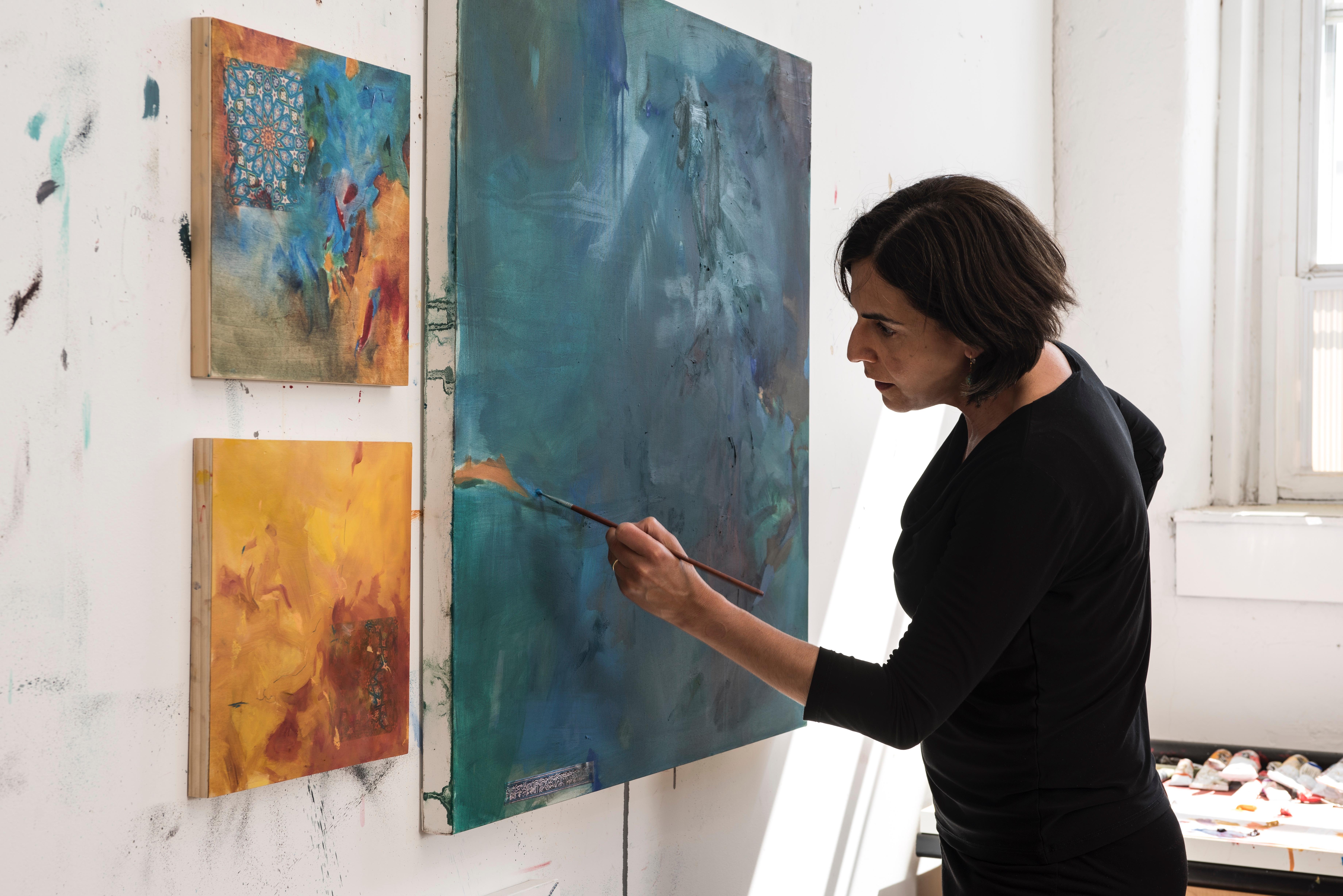 This is an unframed abstract work on paper with calligraphic gestural brushwork in red. It is signed on the back. Iranian-American artist Nazanin Moghbeli has training in Persian calligraphy, miniature painting, and music. She borrows techniques