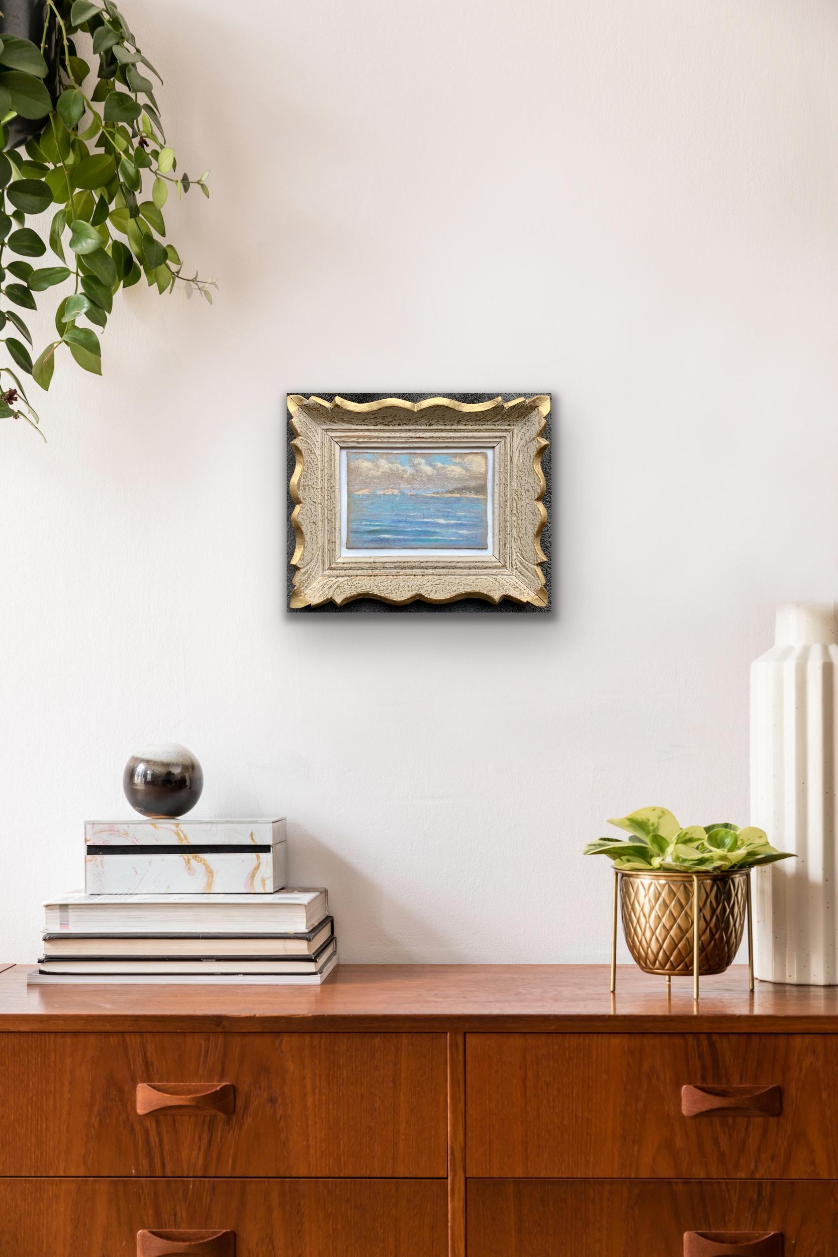 Beautifully vibrant little French impressionist pastel painting depicting a costal view along the Mediterranean Sea. Housed in a beautifully matching frame. Signed lower right. This lovely impressionist painting is a peaceful and tranquil reflection
