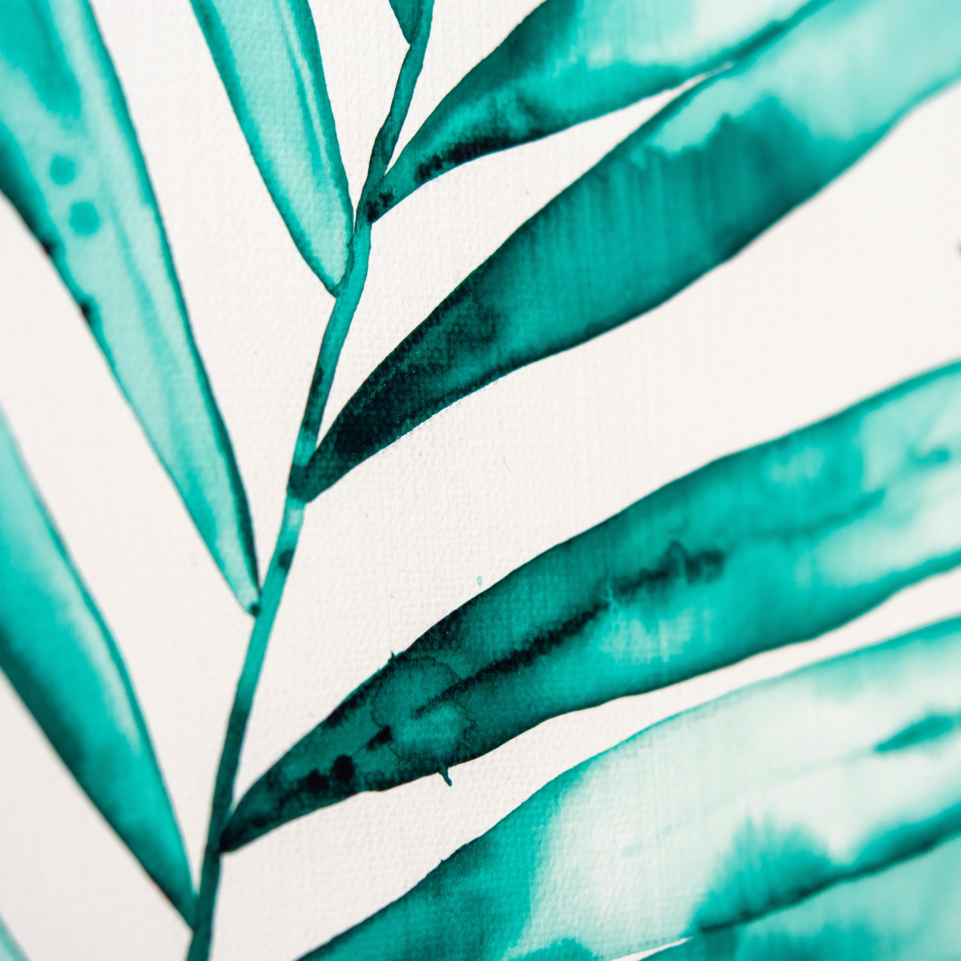 ‘Pair Of Palms' Framed Canvas Original Painting features tropical palm fronds in vibrant tones of green, and white. The epitome of coastal sophistication, Laurie Duncan’s watercolor masterpieces are so intricately articulated they appear tangible. A