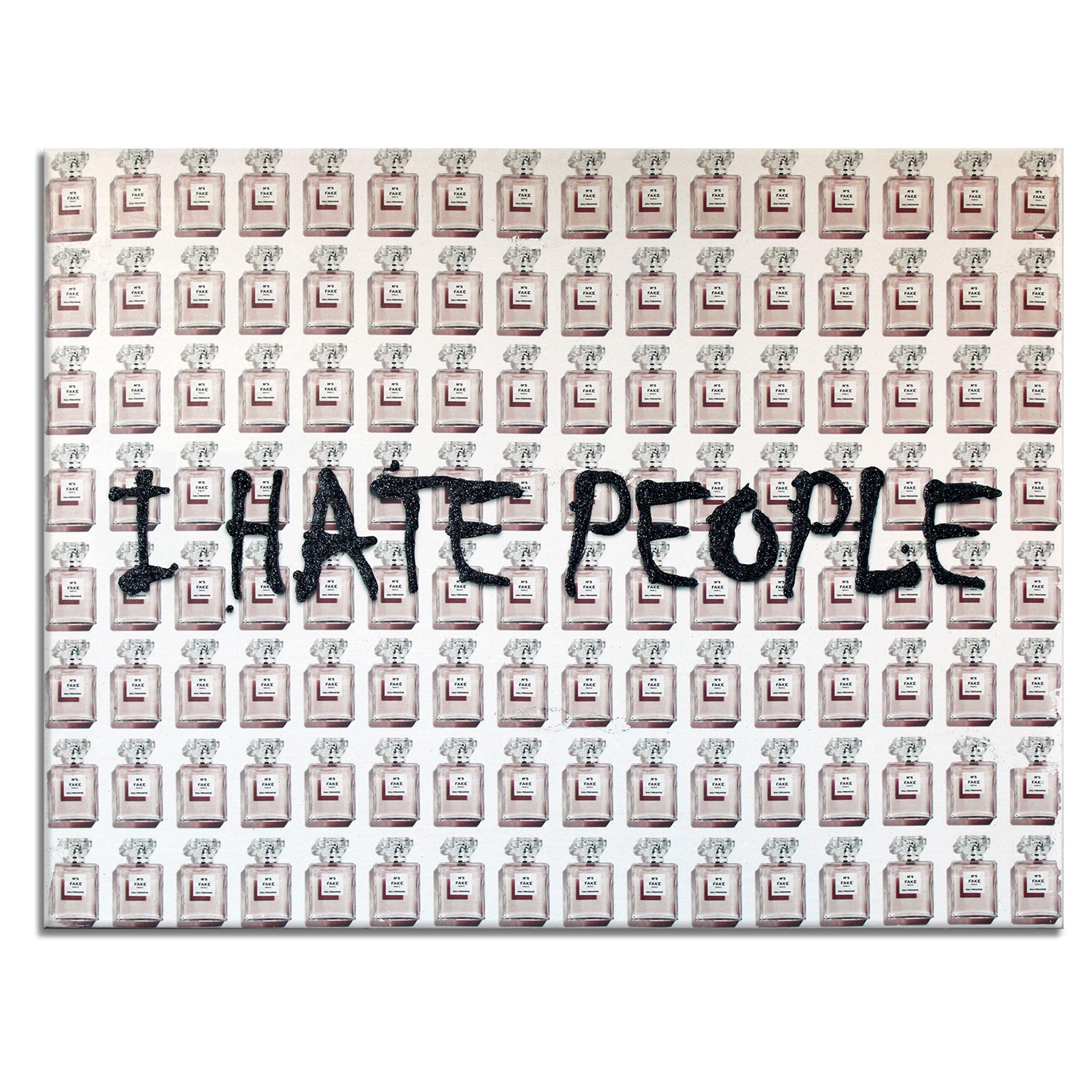 'Pink' Wrapped Canvas Original Pop Art is a bold statement piece, featuring a background pattern of faux Chanel No. 5 perfume bottles in tones of pink and white, veiled with the black-glittered word art "I Hate People." Introspective and playful