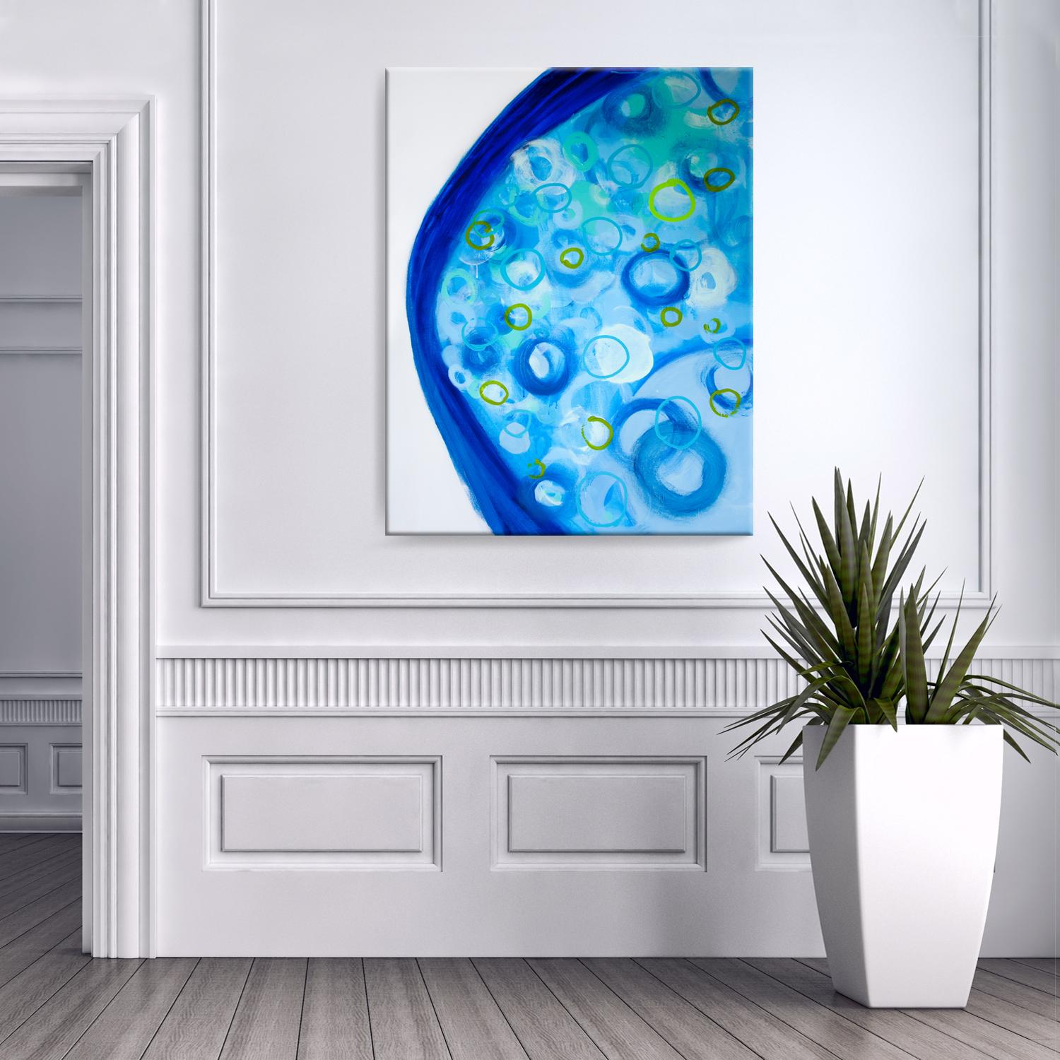 'Caught Up in the Rhythm' Wrapped Canvas Original Painting features a whimsical abstract aesthetic in vivid hues of blue, green, and white. Inspired by her travels and belief of speaking through color, Samerra’s abstract work is a kaleidoscope of