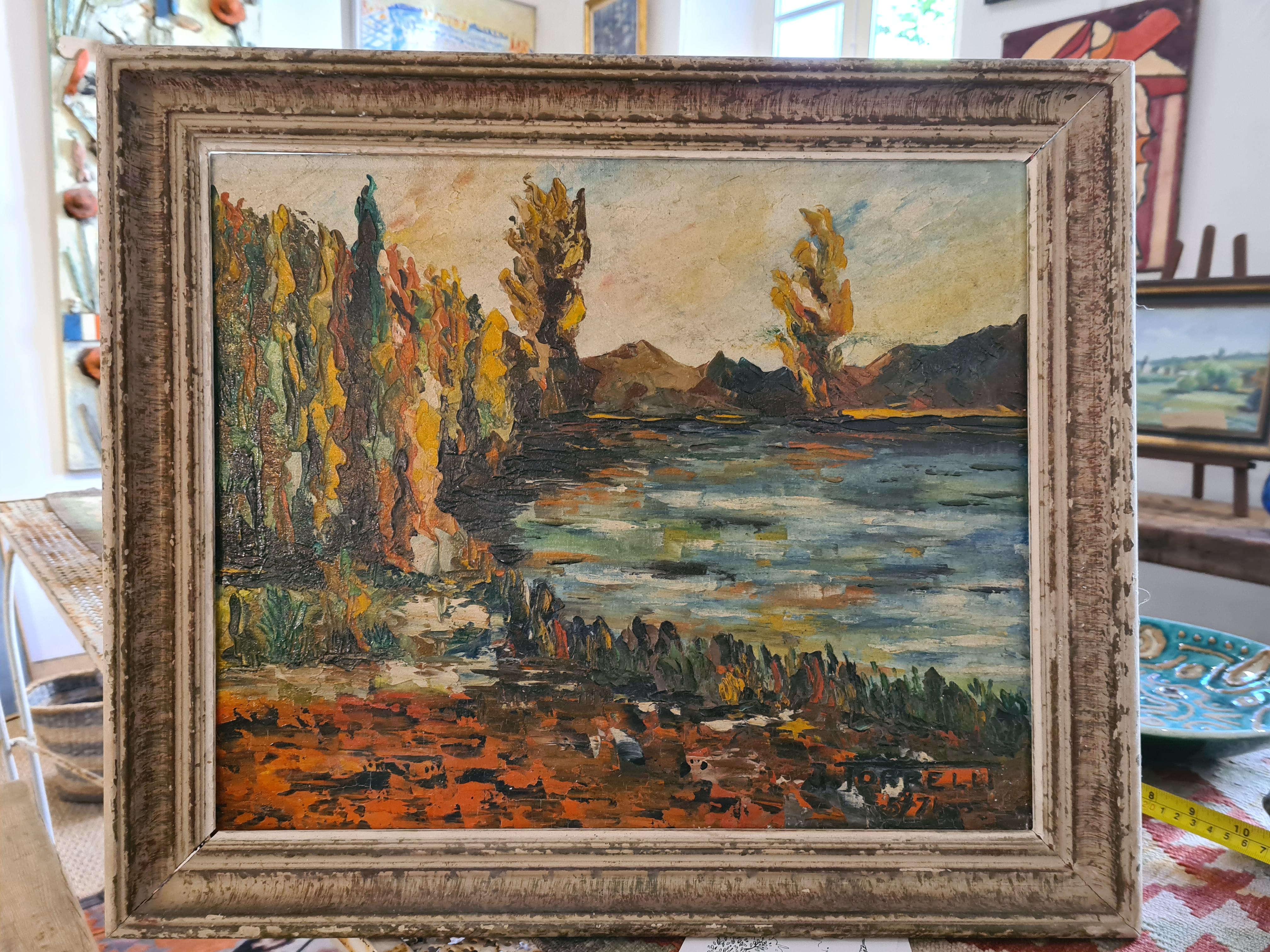 Óleo impresionista de mediados de siglo sobre tabla del artista italiano J. Torrelli.

Este cuadro de la orilla de un lago al atardecer, que recuerda a la 
