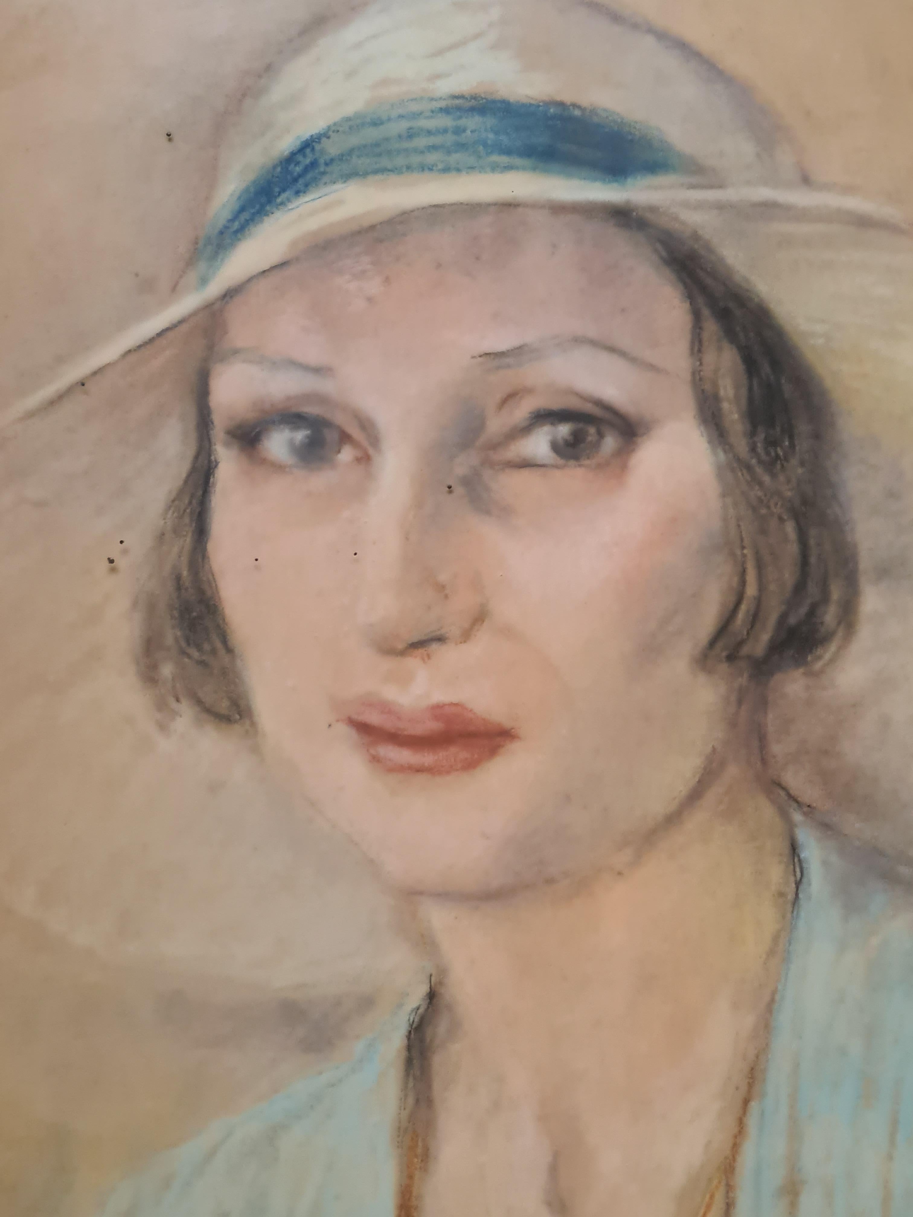 A French art deco pastel portrait by Louis-Jean Beaupuy. The work is signed and dated bottom right. Presented in carved and gilded wood frame.

Beaupuy has captured all the charm and elegance of the sitter. Her large soulful eyes look out from under