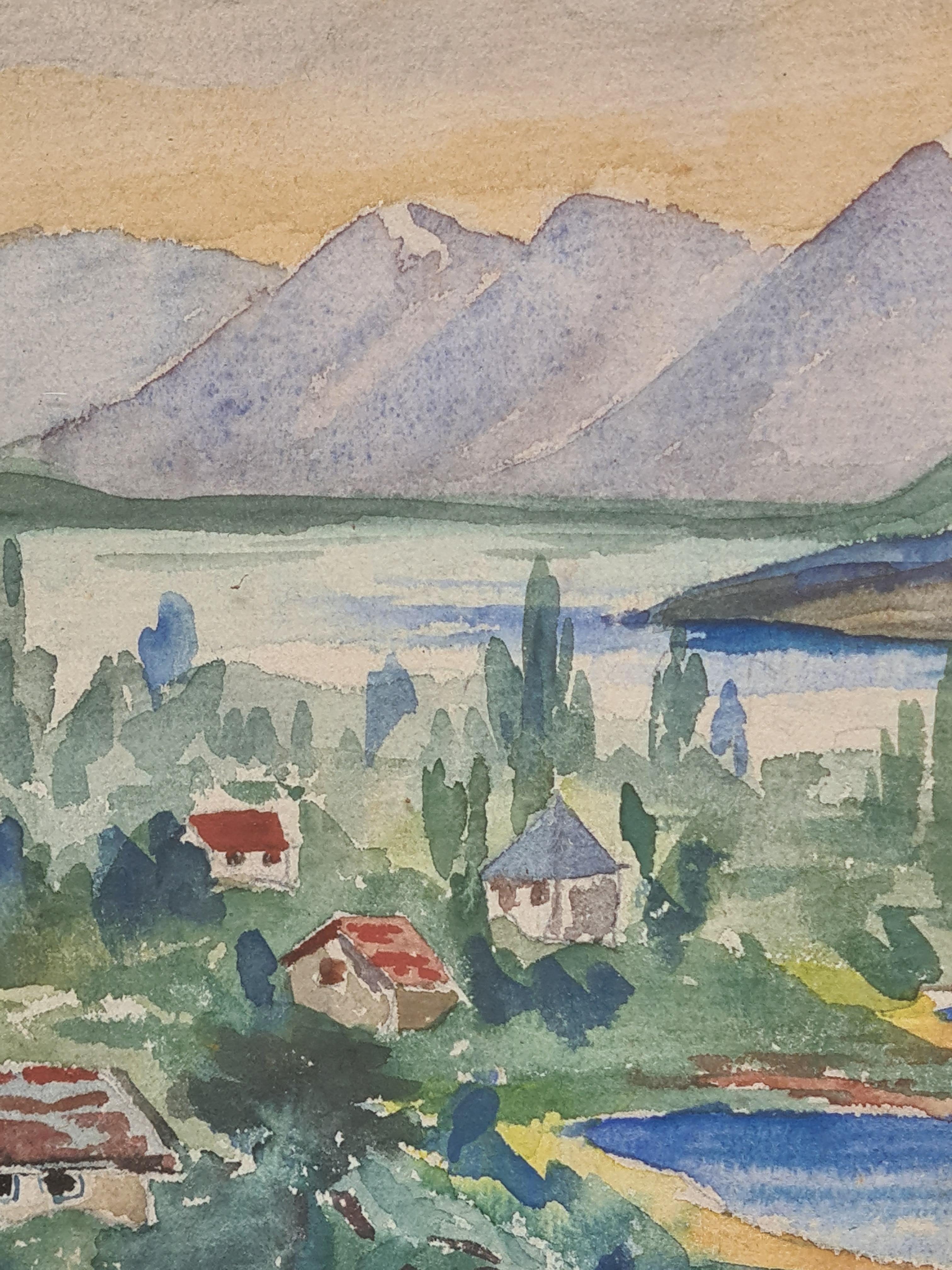Aquarell einer Seelandschaft mit umliegenden Bergen von Nano. Das Gemälde ist unten links signiert und befindet sich in einem schönen, vergoldeten Rahmen unter Glas.

Dieses Gemälde zeigt ein ruhiges Dorf am Seeufer vor der Kulisse majestätischer