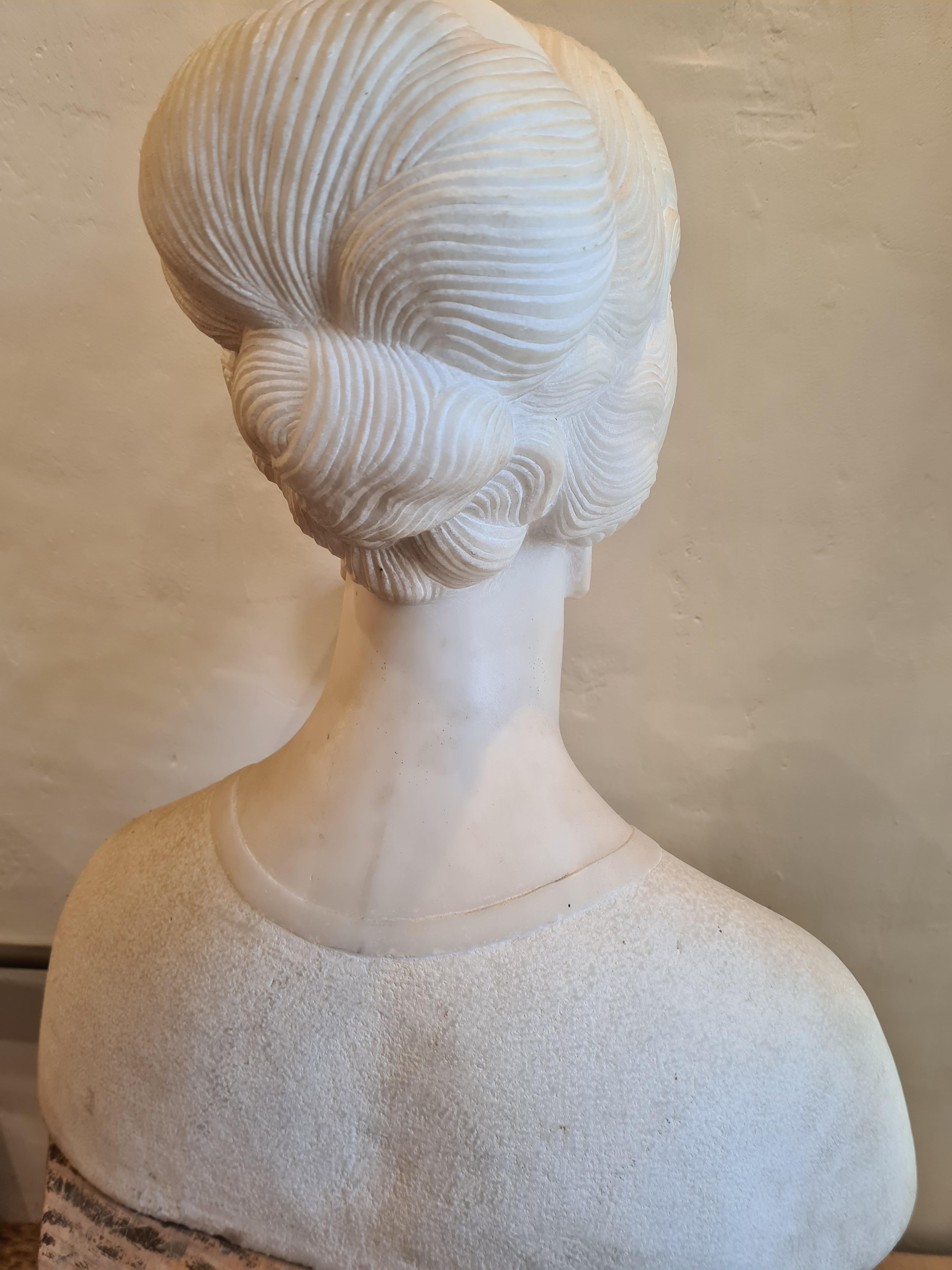 Art Déco period, large Carrara marble female bust sculpture by Raymond Delamarre, one of the pre eminent Art Deco sculptors of his day. Fashioned like a Renaissance Princess but with all the decorative details of the Art Deco period in the handling