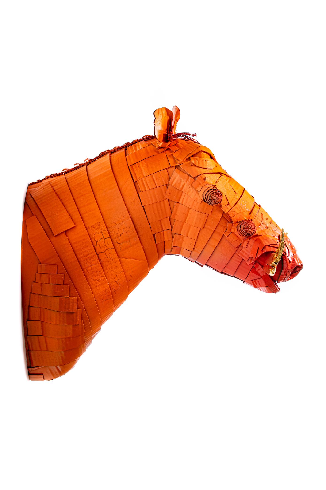 Warthog sculpture in Hermès Orange with Gold Leaf Horn Detail meticulously created by Artist Justin King from individually cut and folded pieces of cardboard and papier-mâché. King’s choice of color and ornamental detail emphasize the spirit of the