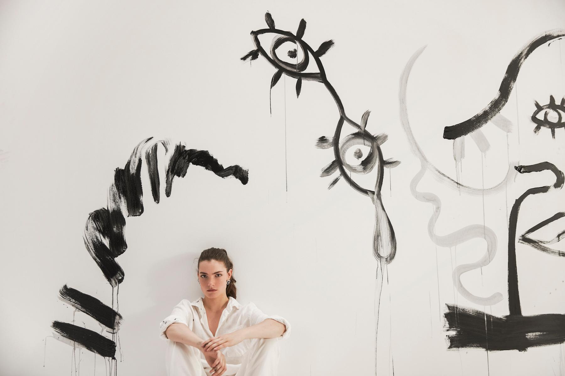 Claire Laffut devant sa toile - Photograph by Charlotte Abramow