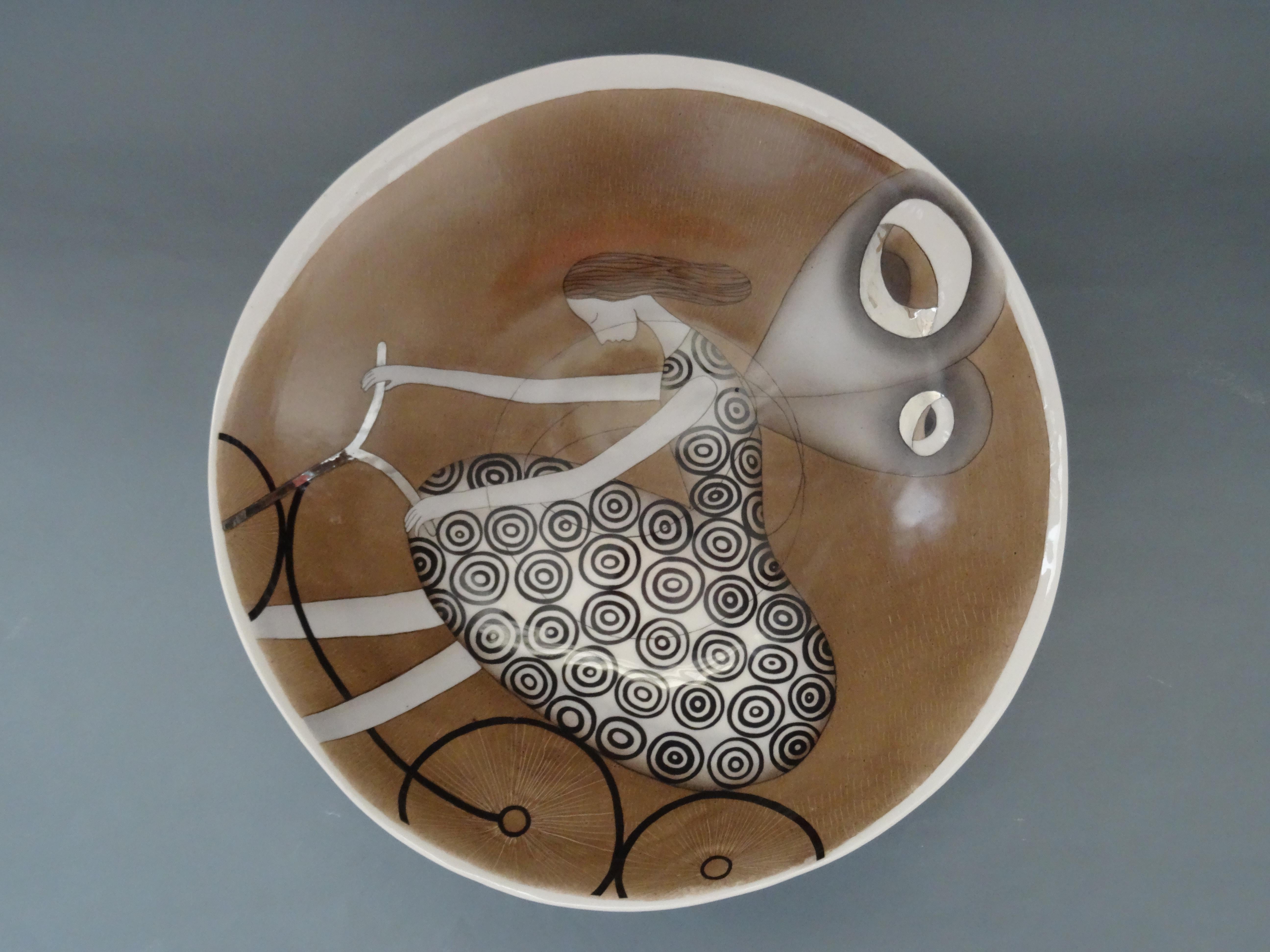 Porcelain plate - A cyclist with wings. 2016, d 36 cm - Sculpture by Inese Margevica 