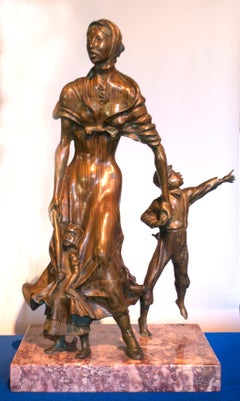 « Femme et enfants de Pioneer », sculpture en bronze et marbre de Harold Castor