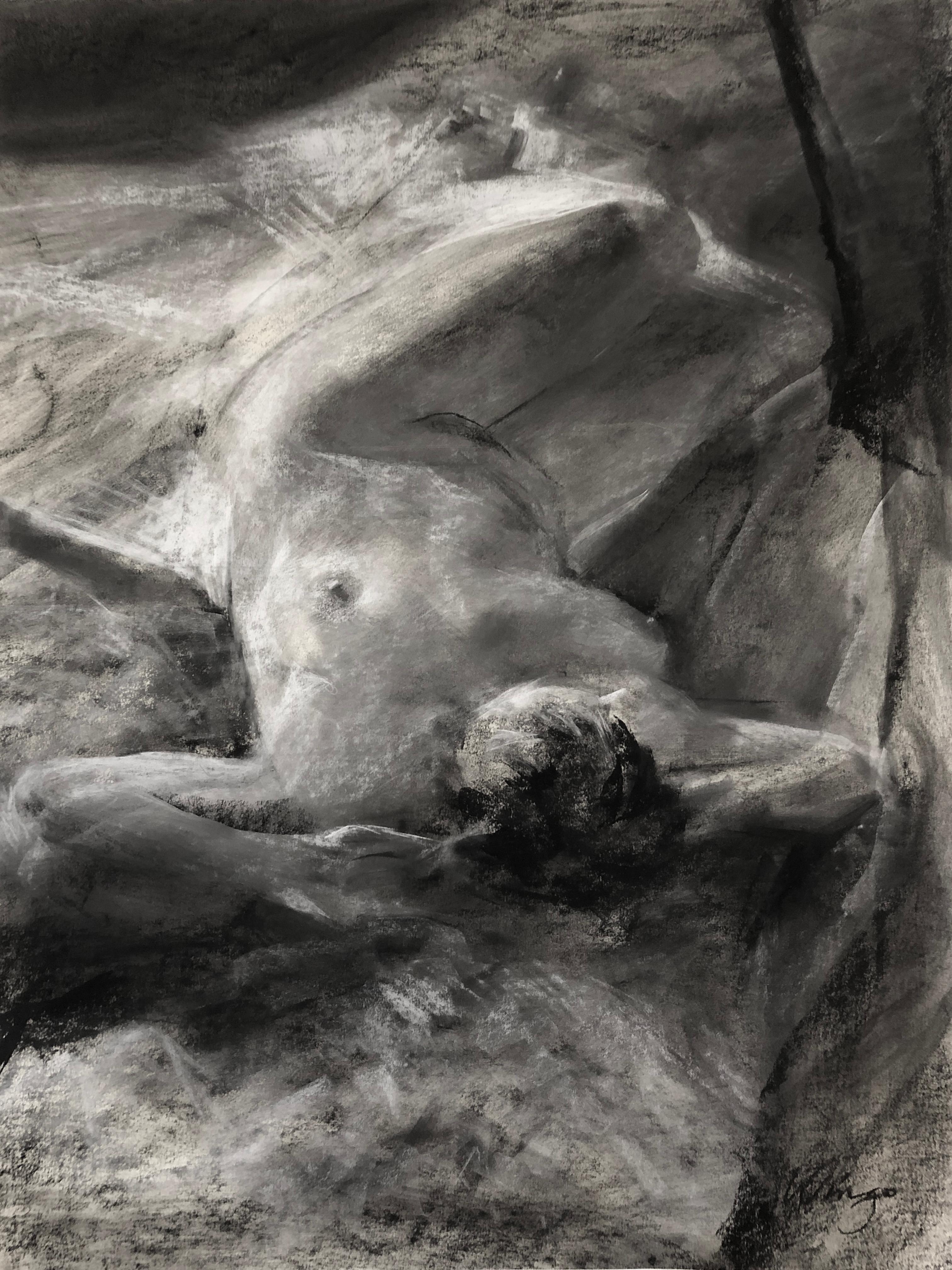 In this charcoal drawing by Paul Wingo, the female nude lays in repose on a white sleeping surface with the upper body positioned at the bottom of the drawing. The realistic drawing of the figure in charcoal and conté is delicately handled by the