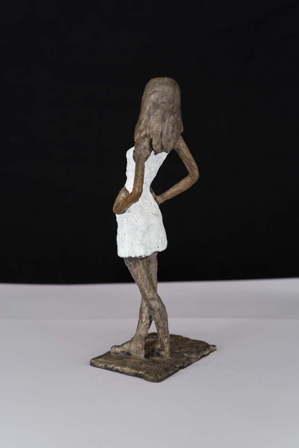 Girl in Mini - contemporary bronze sculpture, nude female with white dress - Sculpture by Susanne Kraisser