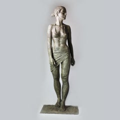 Ebb- contemporary bronze sculpture of life-size Bikini Woman walking confidently