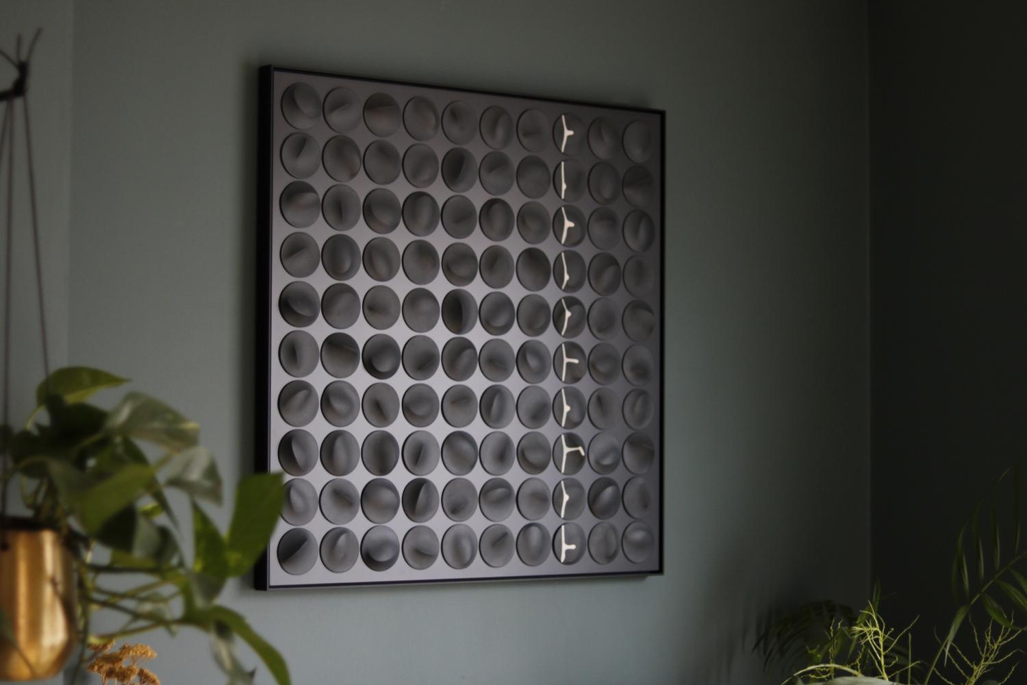 Porcelain Slip Cast Discs (black discs with white drip)
Mounted on Black Matte Aluminium
Black Aluminium Frame

David Burns creates ceramic and metal wall art characterised by the elegance of porcelain clay and the forms and craftsmanship of slip