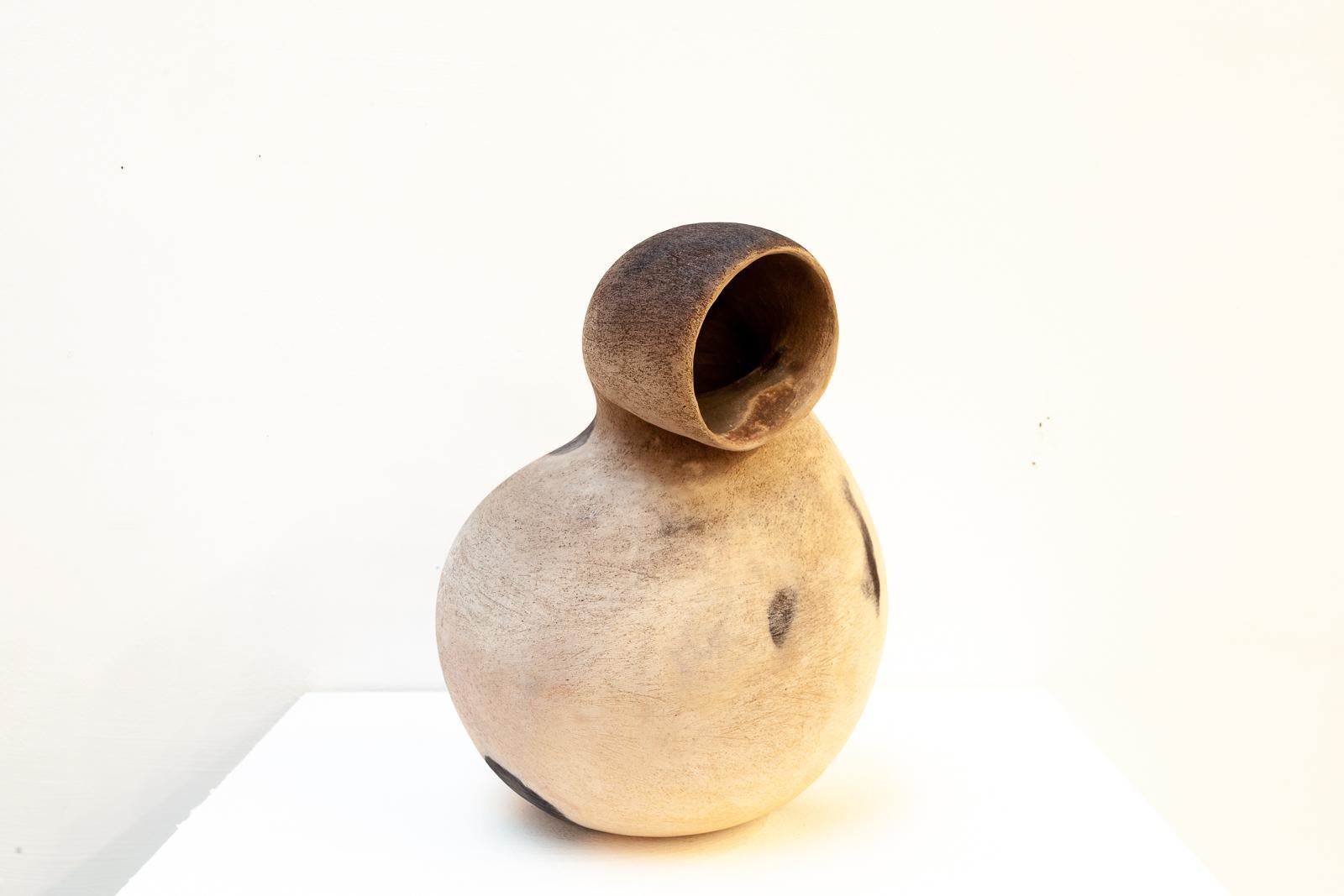 Handbuilt, Sawdust fired Ceramic. From her earliest experiments in art Alison has found the variety and beauty of the human form endlessly fascinating and life-drawing was her first love. For her the human element is vital. 

It was whilst training