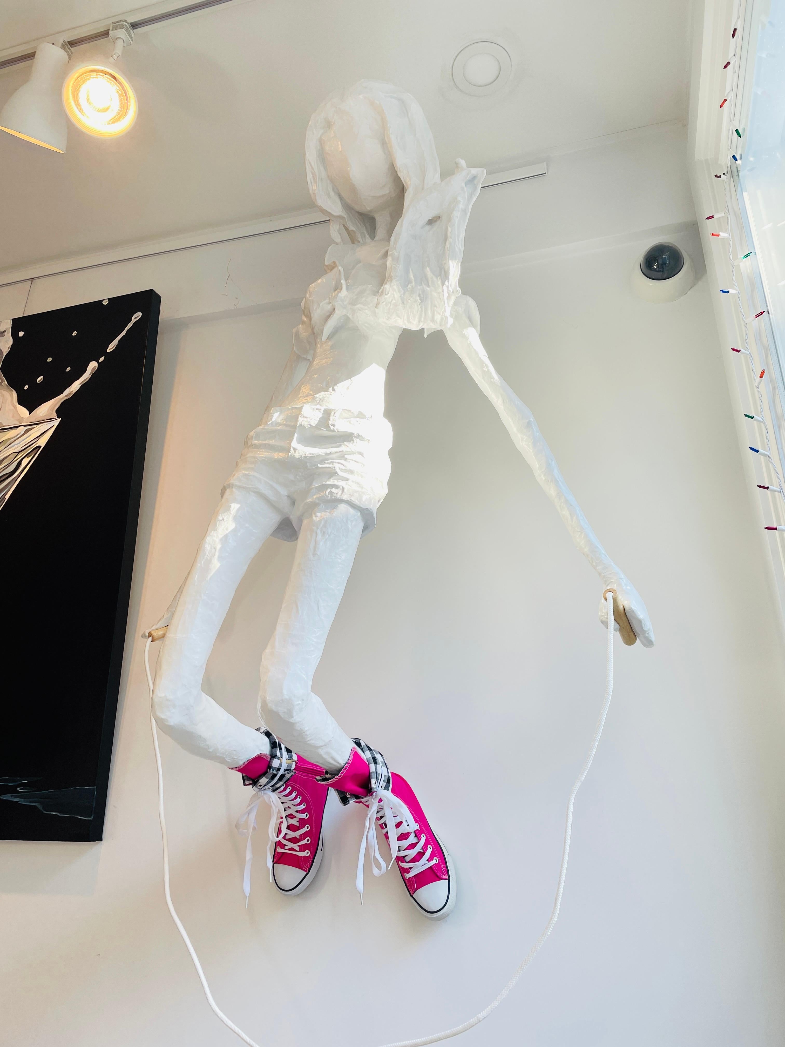 Bret Reilly Figurative Sculpture - Wall Mounted Sculpture of a Girl with a Skipping Rope. Title - The Skipping Girl