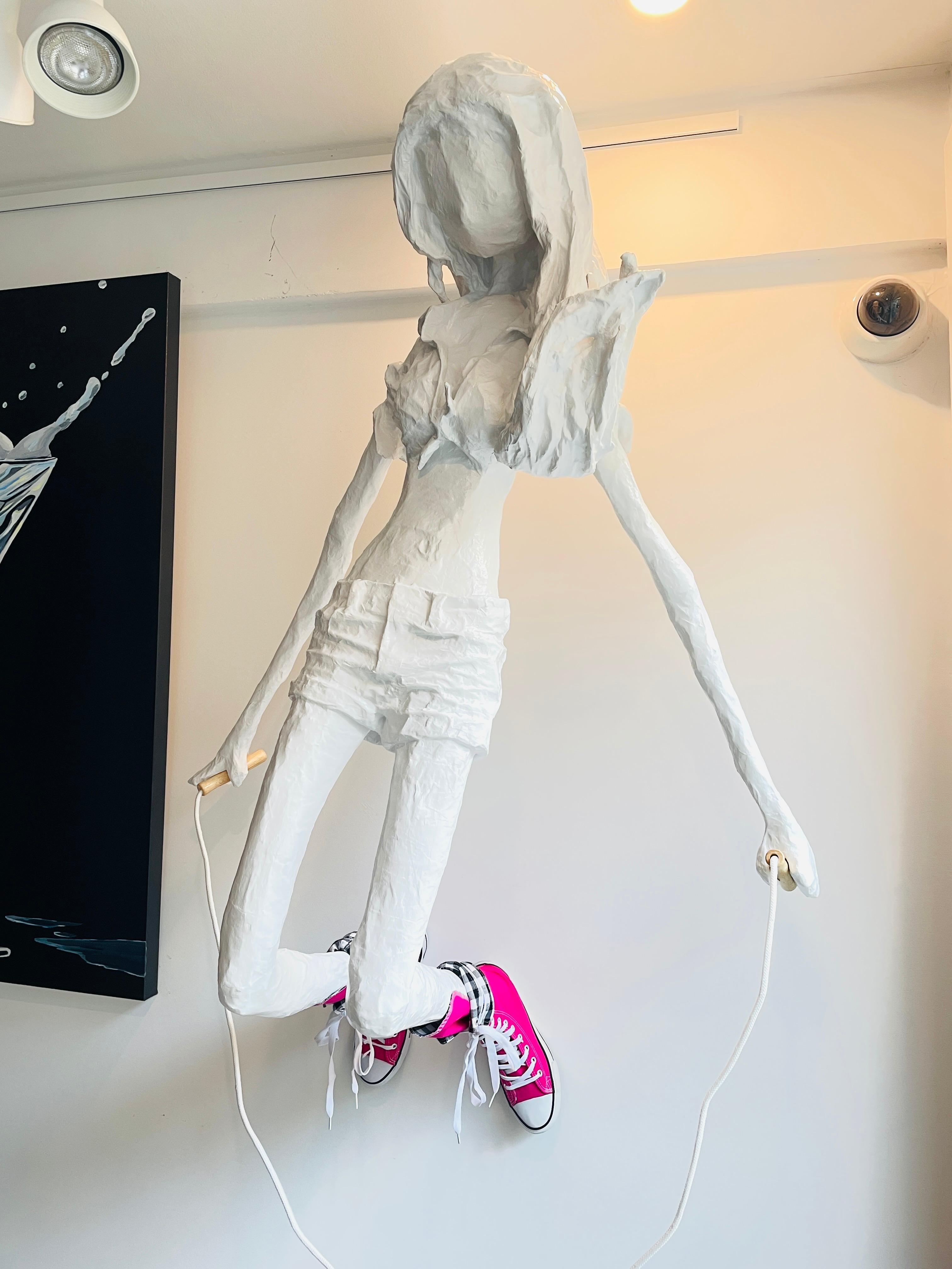 Skipping Girl is a wall sculpture by American artist, Bret Reilly.  Reilly is a true 21st century Renaissance man. His sculptures, songs, and furniture designs attest to a brilliant and creative mind. The present sculpture, entitled Skipping Girl,