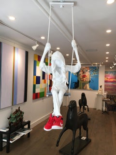 Suspended Ceiling Sculpture of a Girl on a Swing. Title - Girl on a Swing