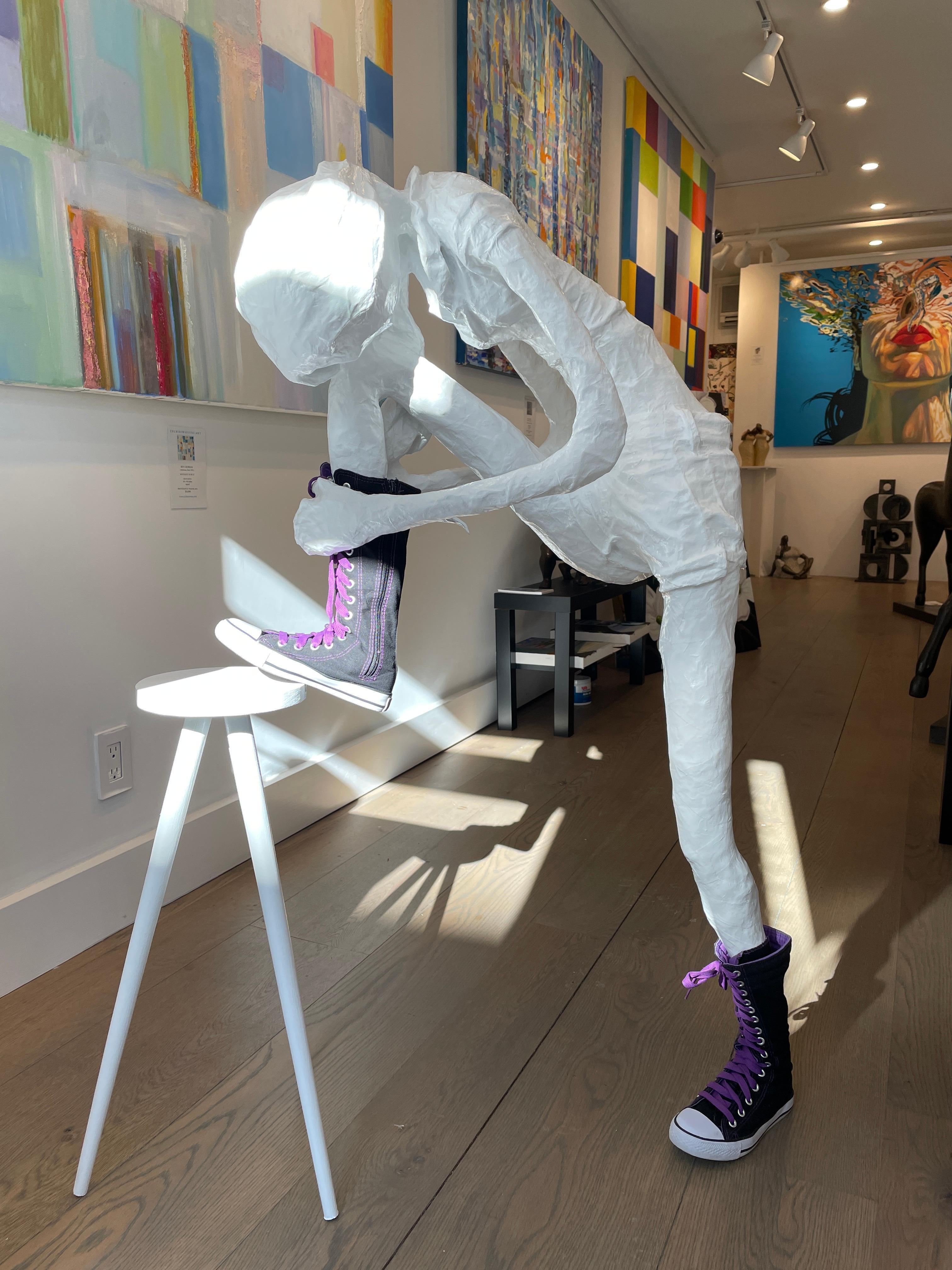 Bret Reilly Figurative Sculpture - Floor Sculpture of a Girl Tying Her Shoe on a Stool. Title - Girl Tying Her Shoe