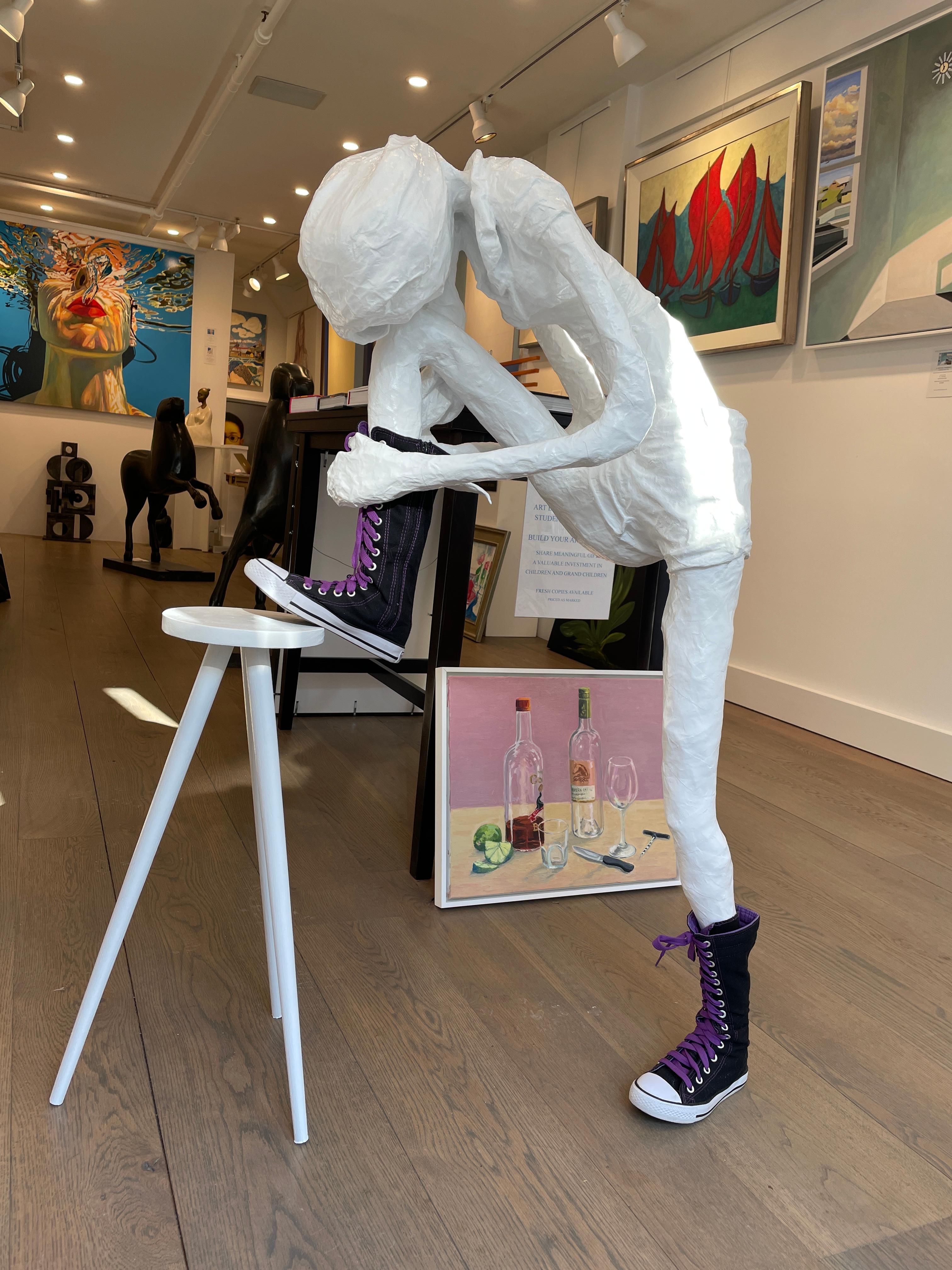 Girl Tying Her Shoe is a free-standing floor sculpture by American artist, Bret Reilly.  Reilly is a true 21st century Renaissance man. His sculptures, songs, and furniture designs attest to a brilliant and creative mind. The present sculpture,