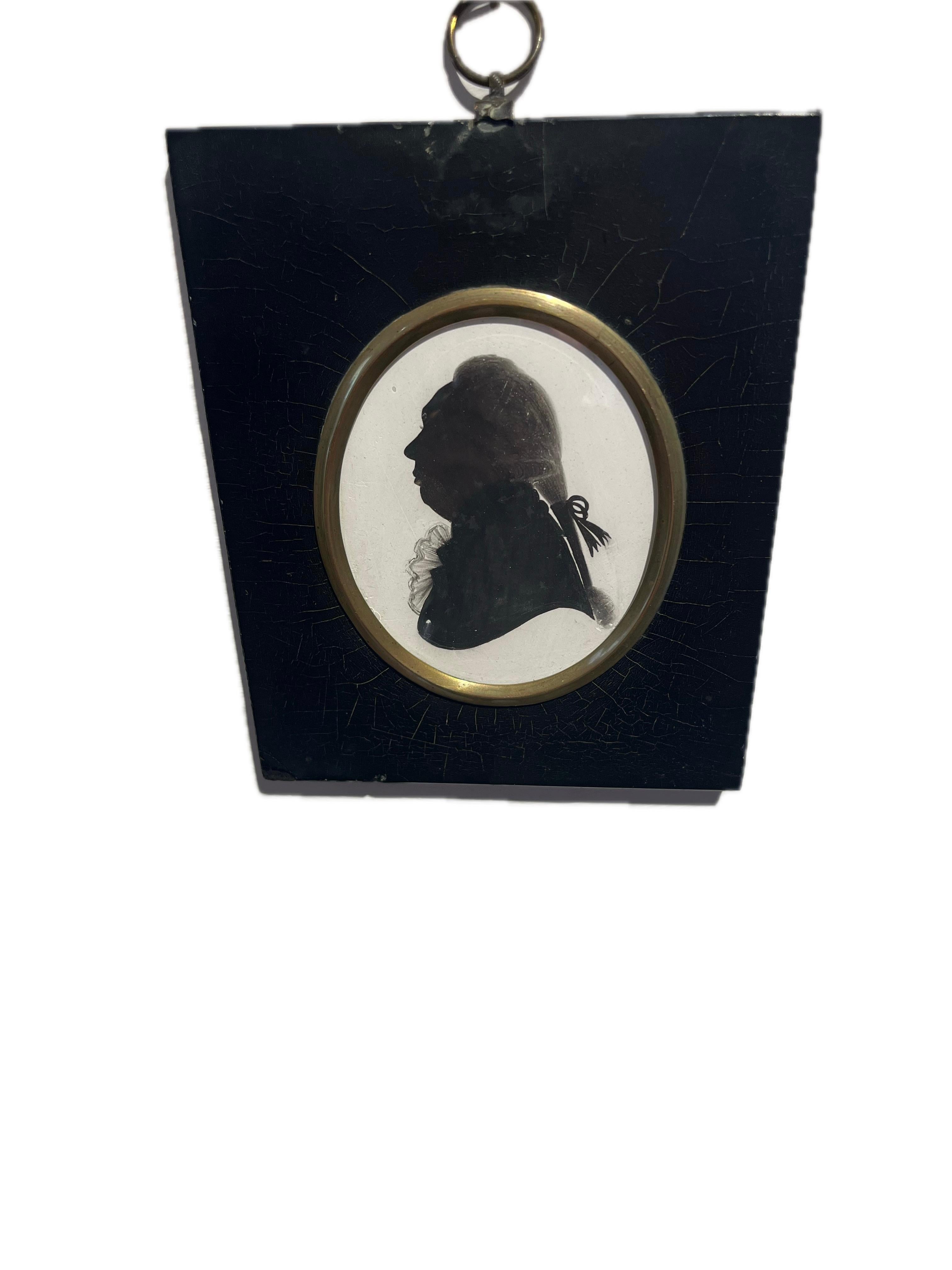 A very finely detailed silhouette in very good condition by one of the truly great silhouette artists of the Georgian period.

John Miers (1758-1821)
Portrait of a gentleman, profile to the left, wearing coat, frilled cravat, pigtail wig tied with a
