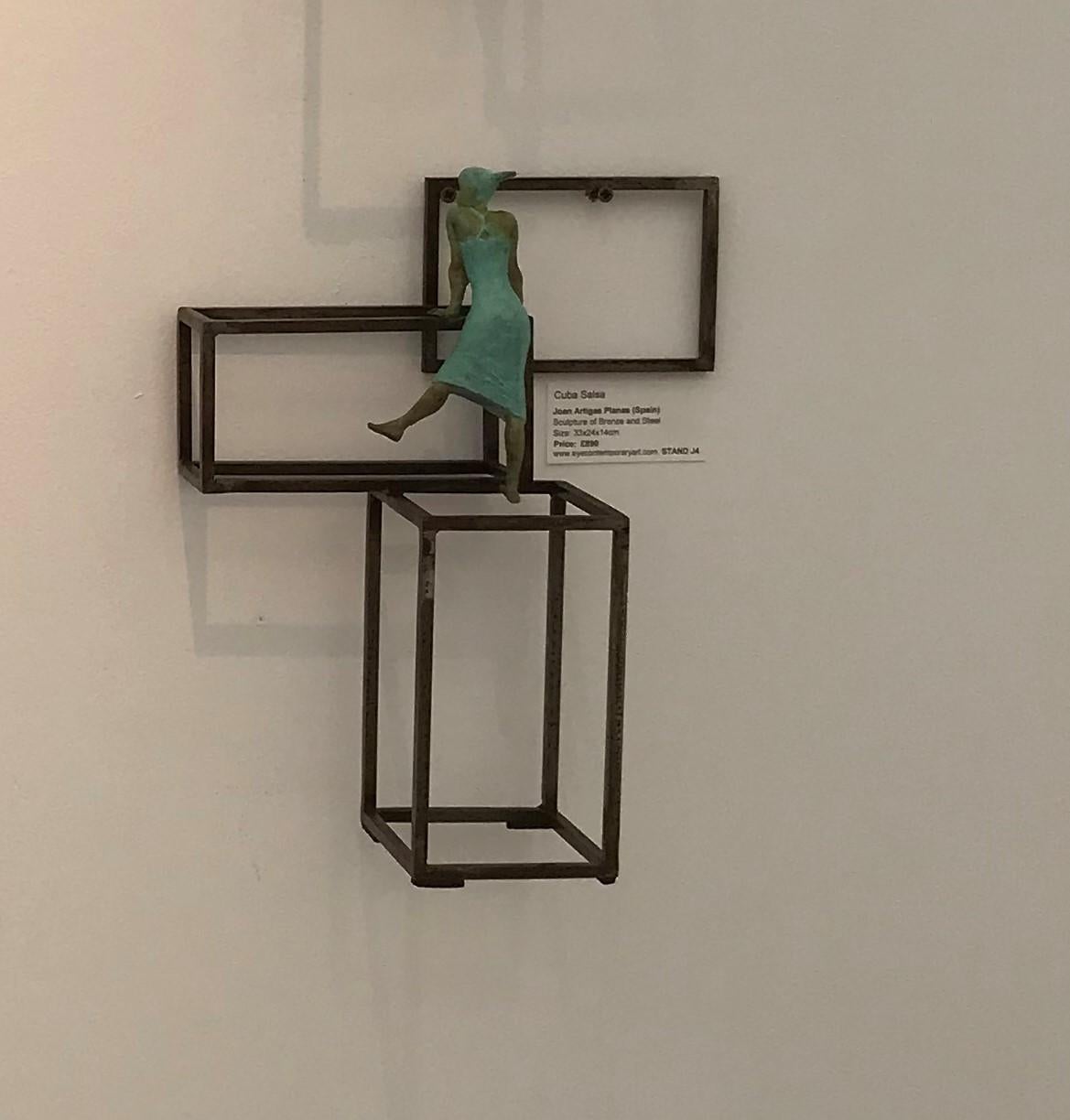 Cuba Salsa (Small) is a bronze sculpture with green patina, it is connected to a steel base. The edition size is 50. This sculpture stands on shelf as well as be hung on wall. This sculpture is part of the Cuba Series of Joan Artigas which is