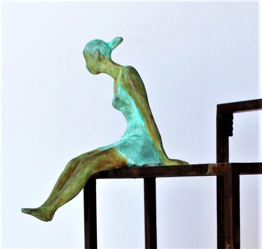 Discovery is a bronze sculpture with green patina, it is connected to a steel base. The edition size is 50. This sculpture stands on shelf as well as be hung on wall.  

Joan’s latest sculpture series of female figures brings an out-of-the-box
