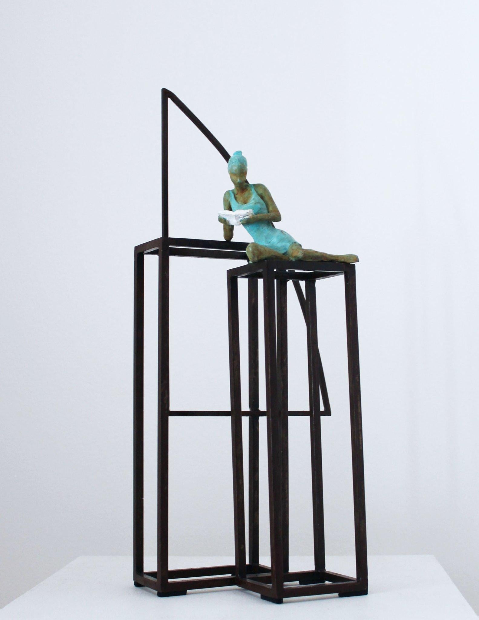 Literature is a bronze sculpture with green patina, it is connected to a steel base. The edition size is 50. This is a mural sculpture and can stand on a surface. Joan captures the mood of a girl enjoying moment of freedom and time with herself