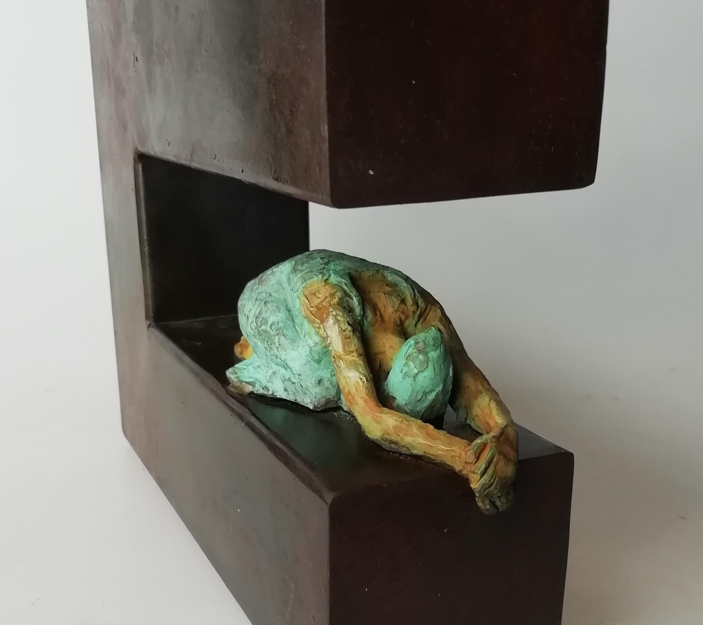 Oppression is a bronze sculpture with green patina, it is connected to a steel base. The edition size is 25. This sculpture stands on shelf as well as be hung on wall. Joan wants to capture the sensuality of the stretching pose in practising