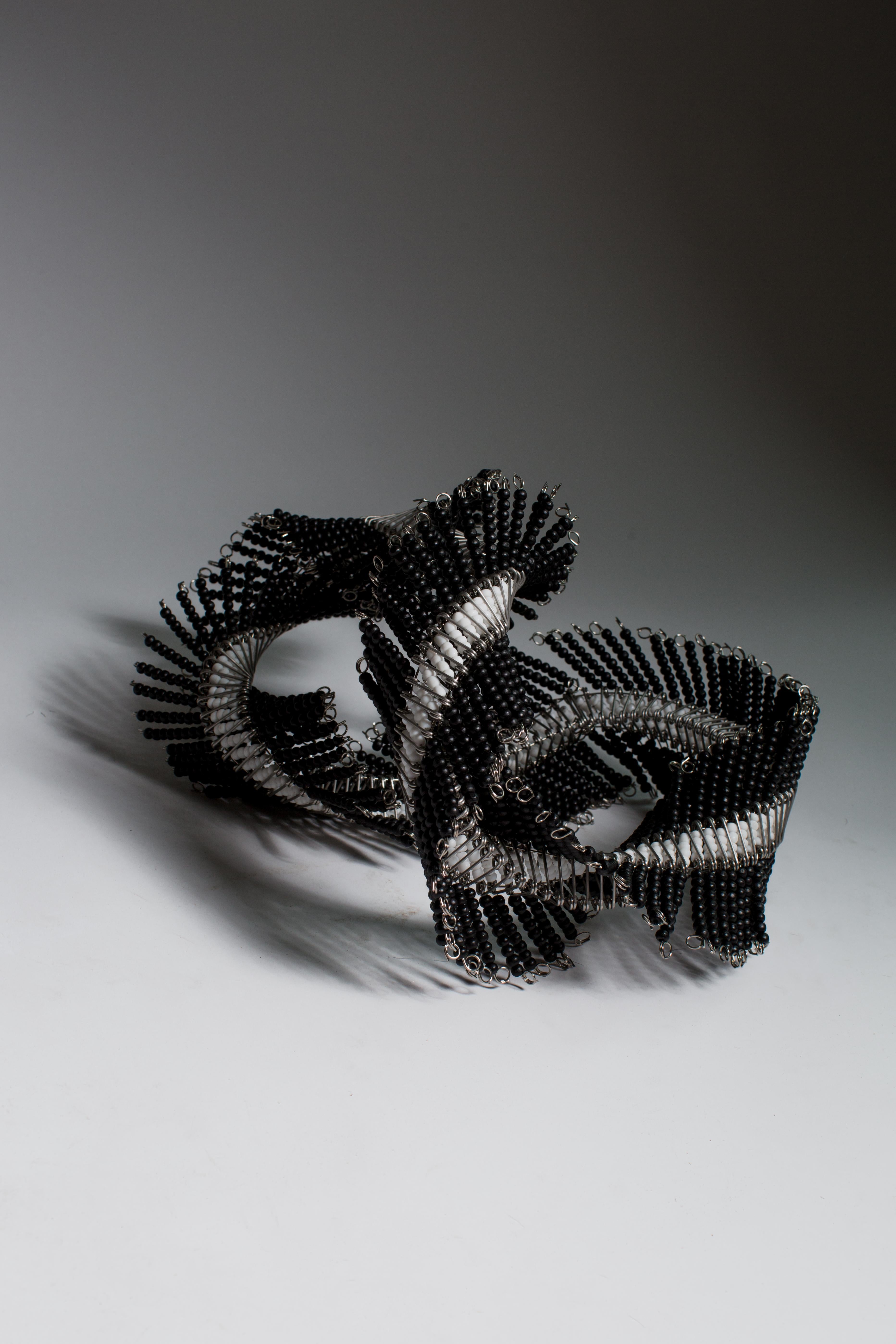 Beaded Whisp 008
Black, White
1/1
Stainless Steel, Wooden Painted Beads, Glass Beads 
25cm x 25cm x 25cm
0.75Kg  
2020

Whisps are meticulously constructed organic sculptural expressions. These expressions are symbolic of what the mind feels like to