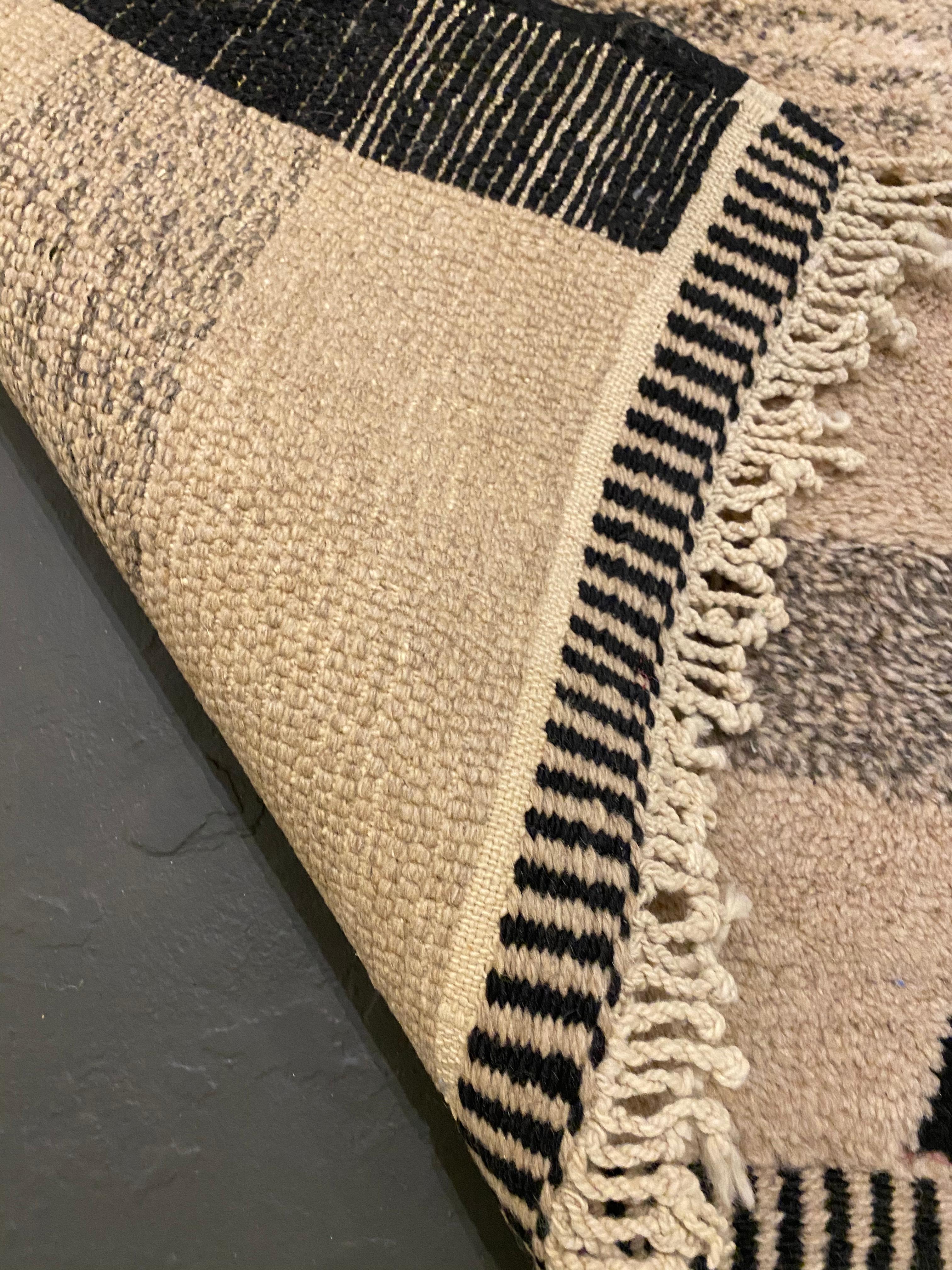 ca. Contemporary  Hand Knotted Wool    
Moroccan rugs are a handmade creation, woven by the women of Berber tribes in the Atlas mountains. Each kind of berber rug is characterized by specific shapes and motifs that refer to the Beliefs of tribal