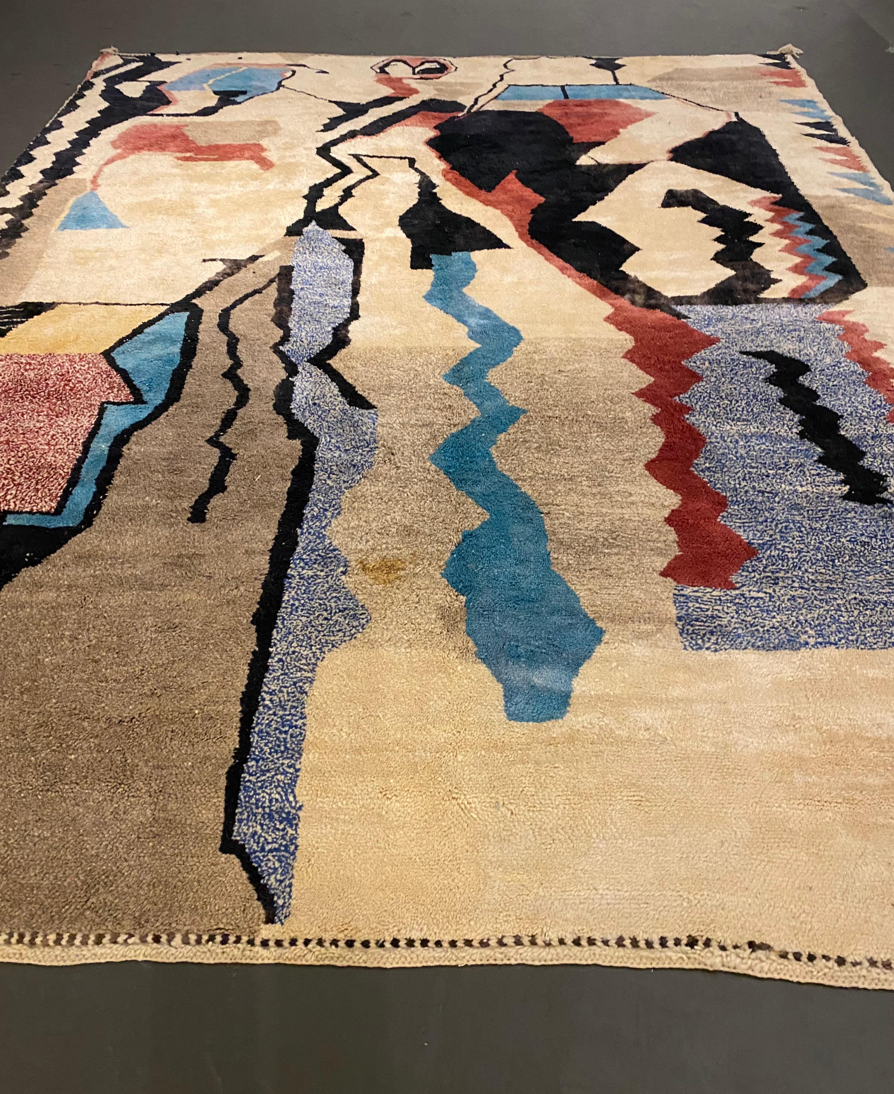 ca. Contemporary    Hand Knotted Wool    
Moroccan rugs are a handmade creation, woven by the women of Berber tribes in the Atlas mountains. Each kind of berber rug is characterized by specific shapes and motifs that refer to the Beliefs of tribal