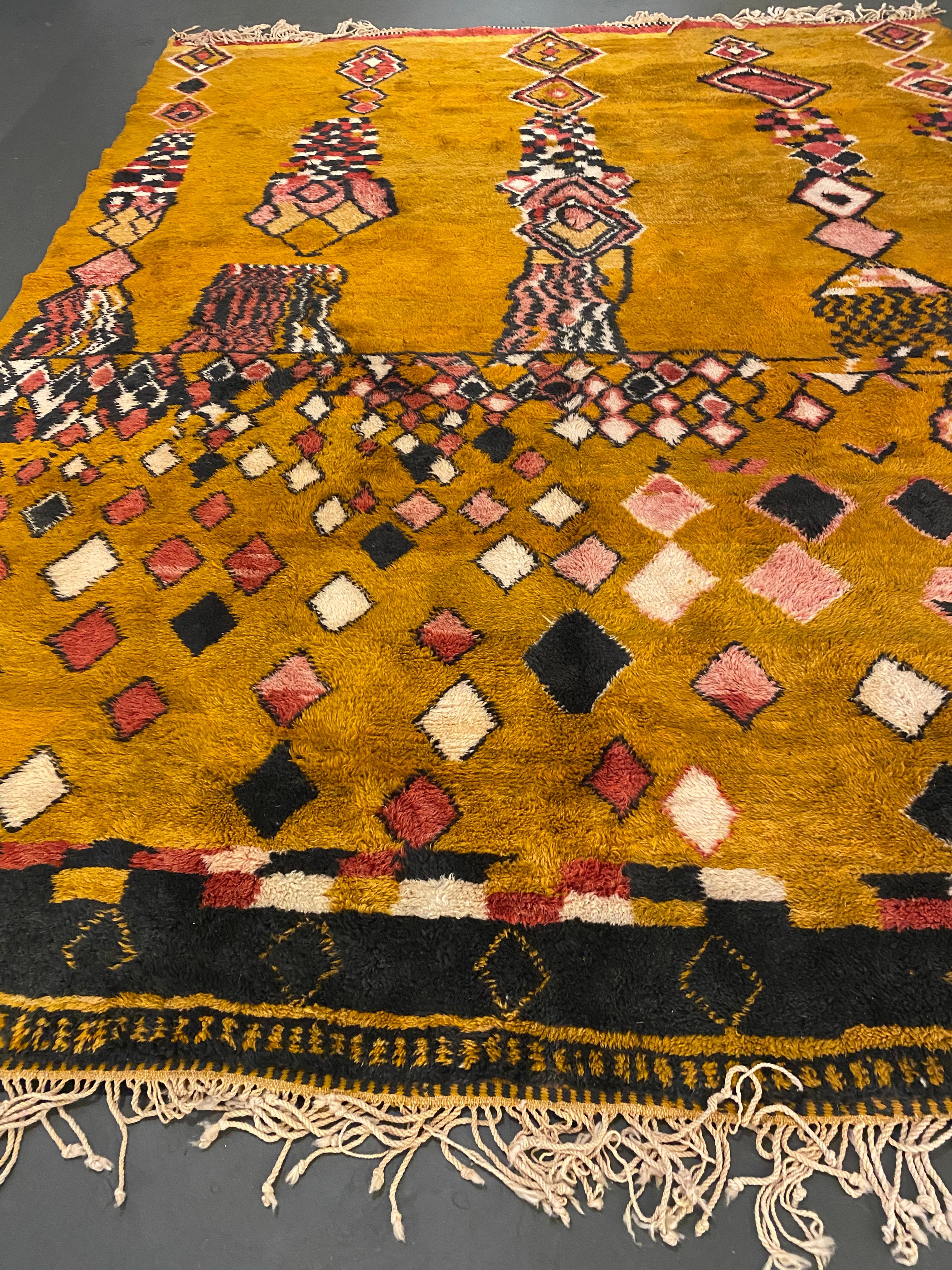 ca. Contemporary    Hand Knotted Wool   
Moroccan rugs are a handmade creation, woven by the women of Berber tribes in the Atlas mountains. Each kind of berber rug is characterized by specific shapes and motifs that refer to the Beliefs of tribal