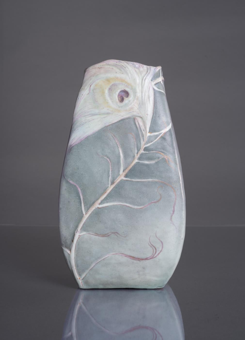 A pair of exceptional earthenware vases by Clément Massier in a unique rectangular form, featuring albino peacock feathers enhanced by accents of purple and gold glazing. As Massier is most closely associated with richly-colored, iridescent glazes,