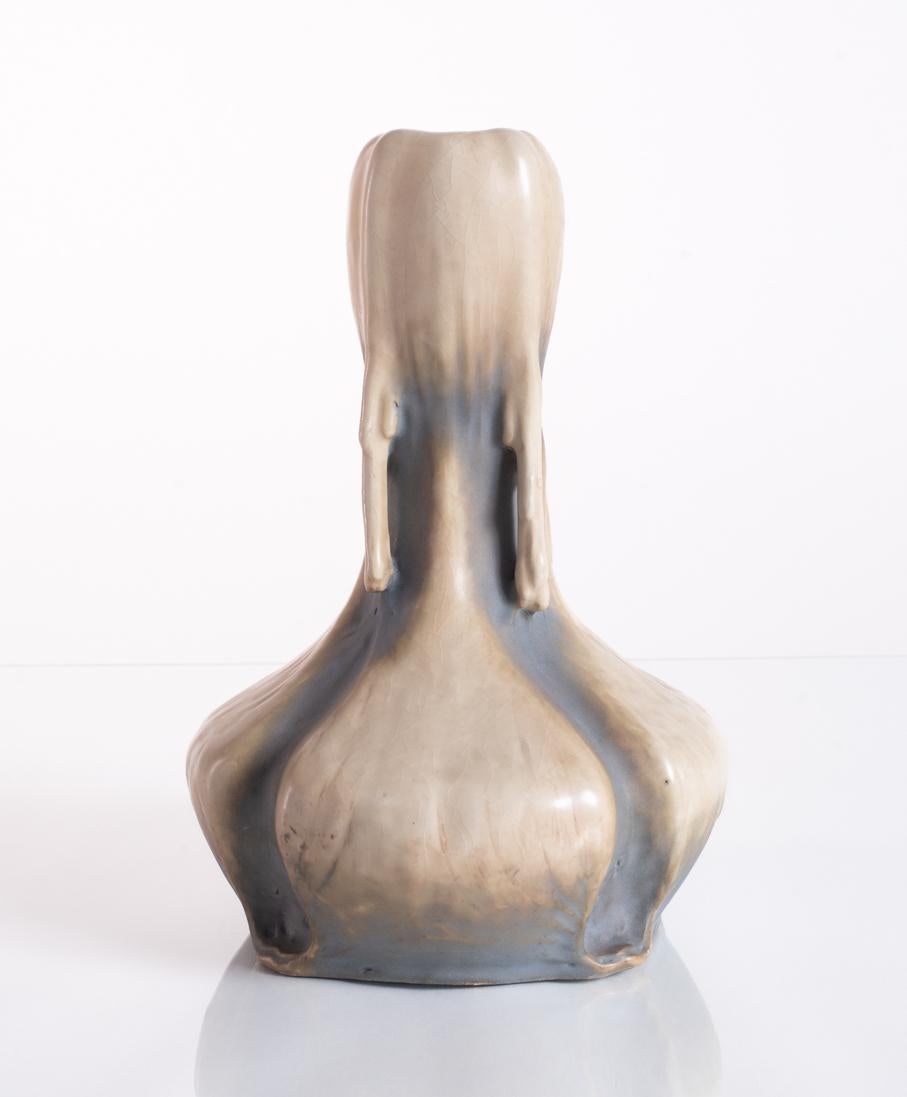 Hard earthenware vase, matte white with blue-gray accents made to evoke ice and winter. The 1900 EDDA series from Amphora was named after two medieval Icelandic poems of Norse mythology, and its pieces were "highly regarded for the original concepts