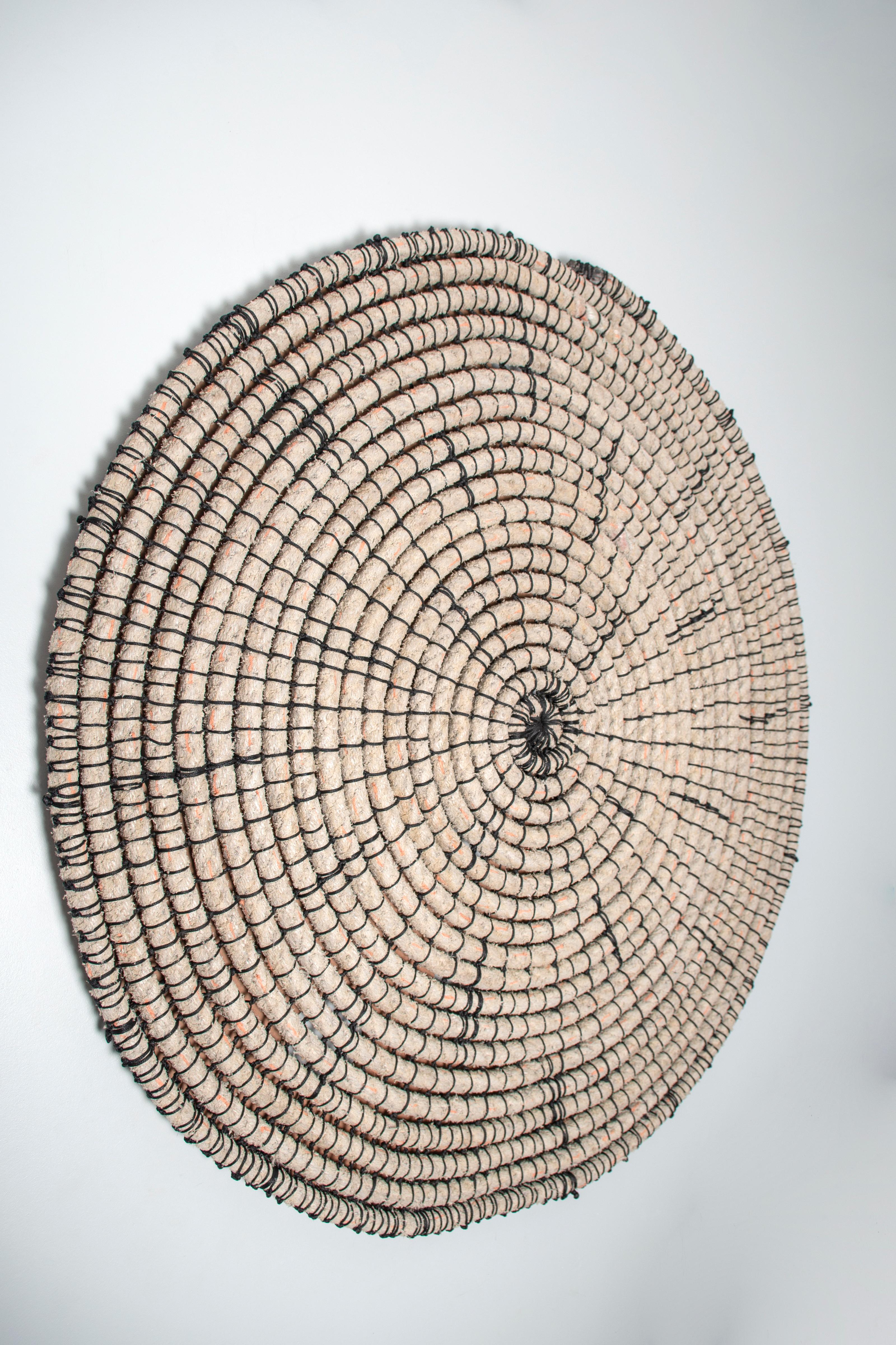 Baskets reimagined 1, 2020. Mixed media: nautical rope and acryclic string

‘Baskets reimagined’ are a series of delicate but visceral wall hangings that are inspired by traditional Ovakwanyama basket weaving. Like Mbangula’s hand-dyed and repeat