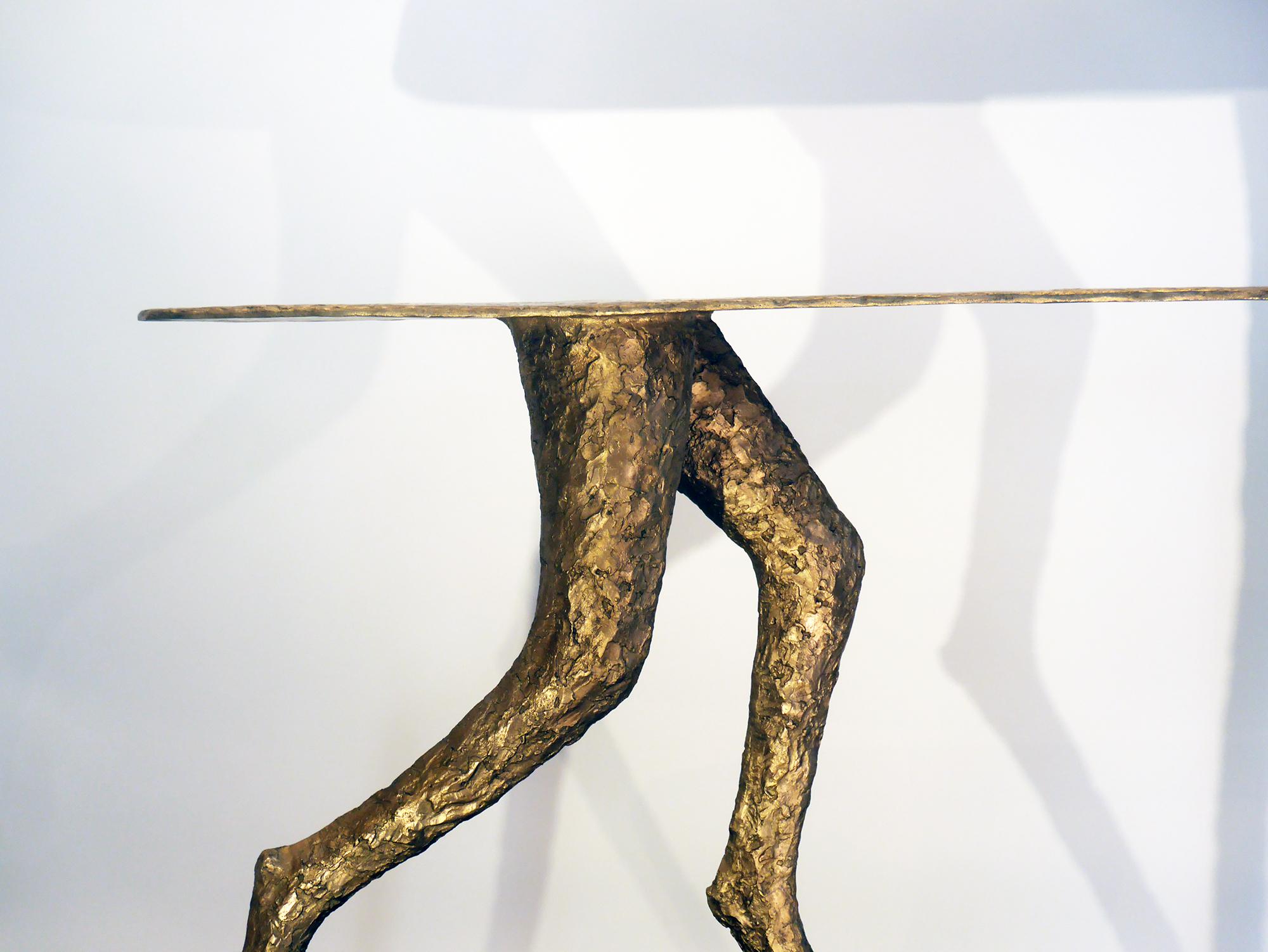 Cadence is a bronze console by the French contemporary artist, Sylvie Mangaud. 
It's an edition of 8, plus 4 artist proofs. One of it is kept by this artist. The edition here is 2/8.

Known for her elongated women or animals in motion, Sylvie has