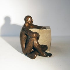 La pause,  figurative bronze by Maguy Banq minimalist male nude seating