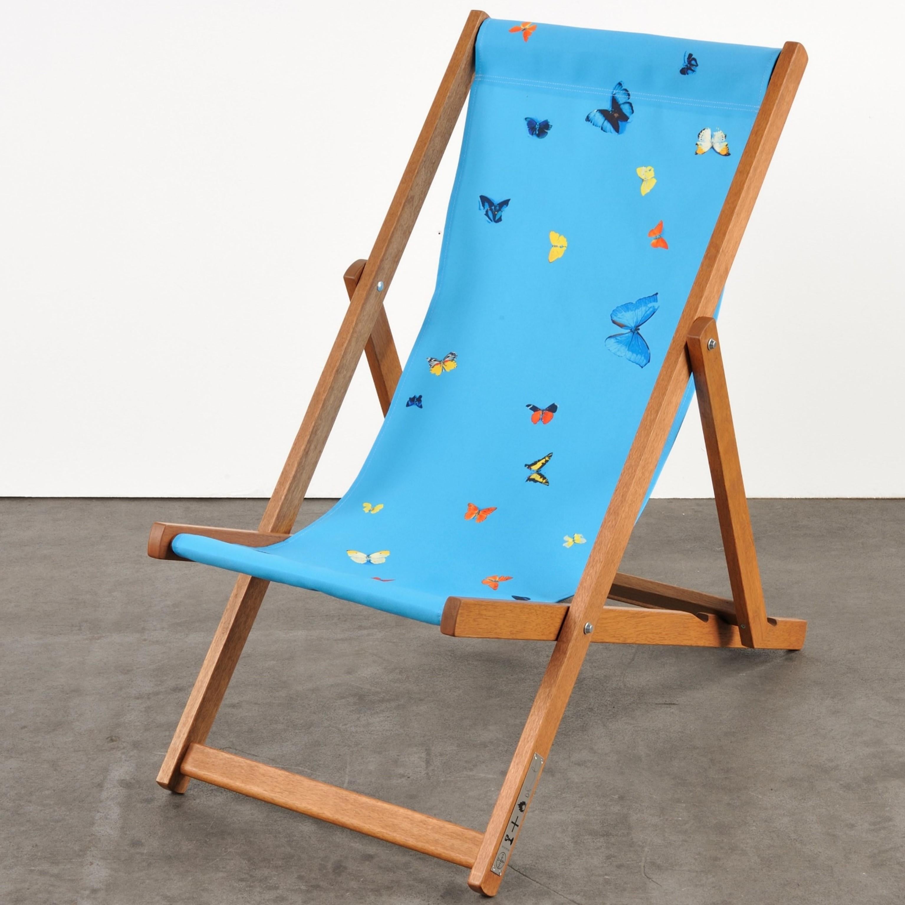 Hirst's Deckchairs use one of the artist's familiar motifs: a monochromatic background interrupted by a scattering of butterflies freezed in an eternal position. 

Damien Hirst
Deckchair (Sky Blue) - Contemporary art, 21st Century, Blue, Design,