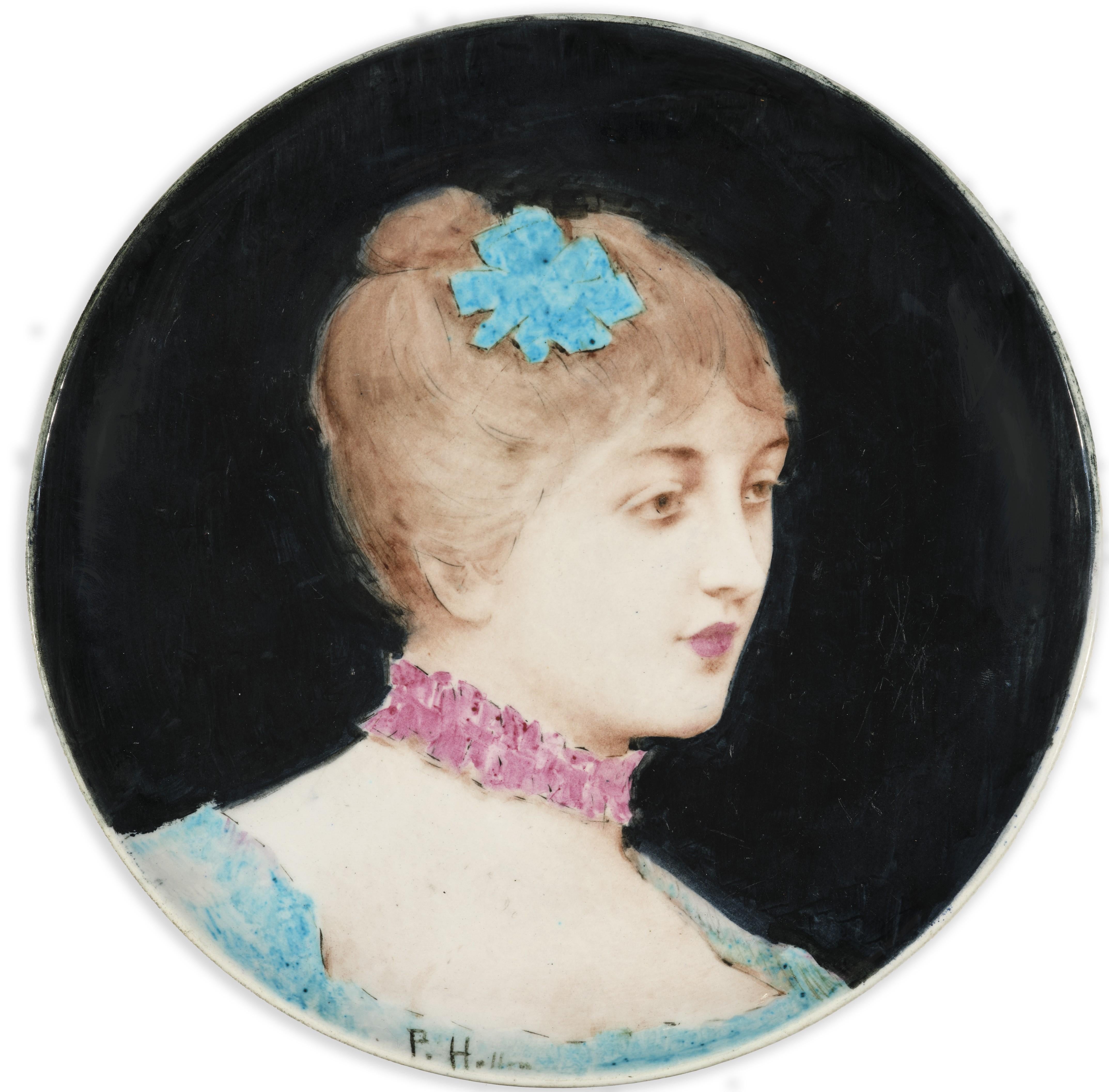 A circular dish decorated by Paul Helleu with a Portrait of a Woman