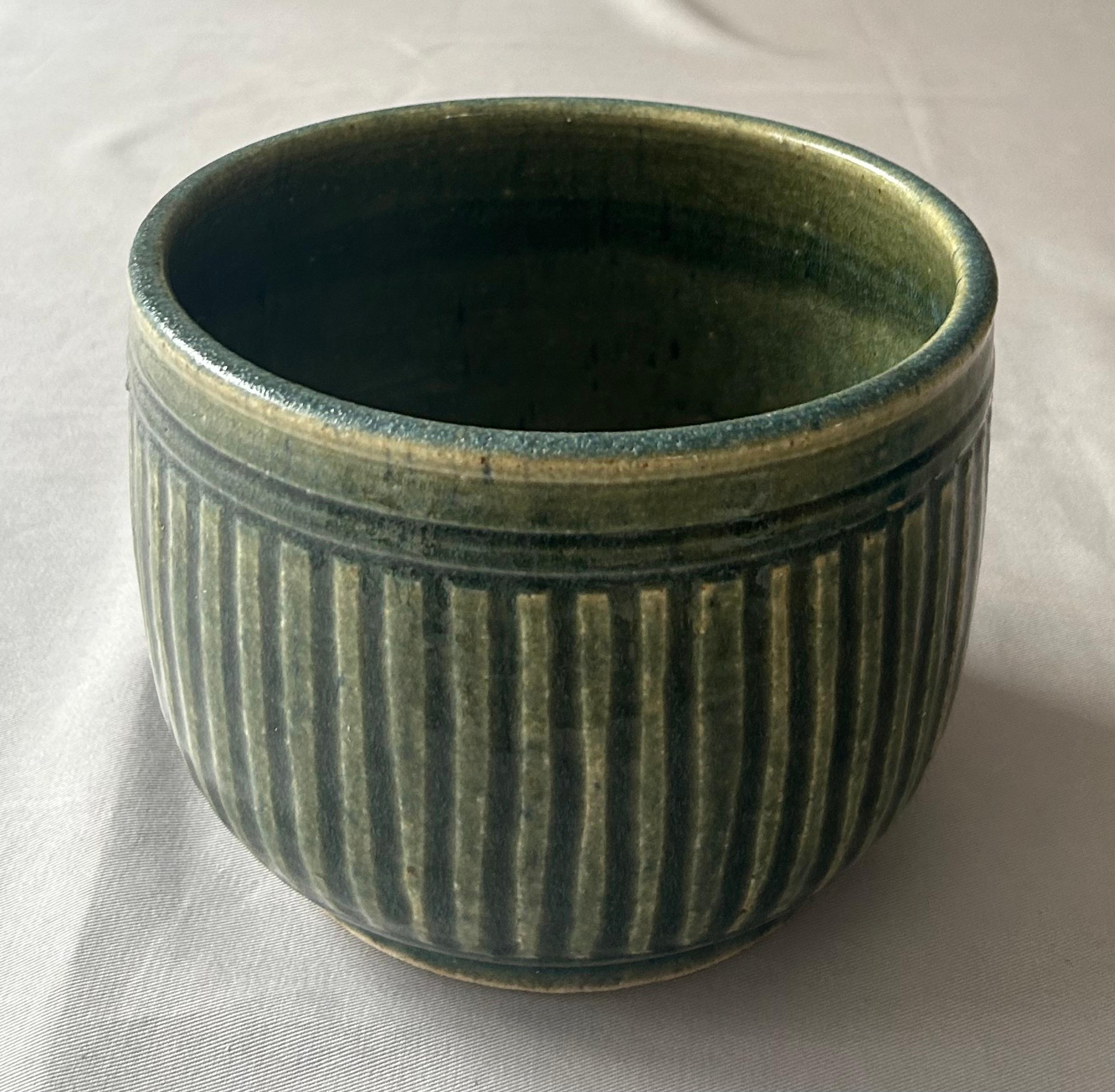 This beautiful Porthleven studio pottery planter was in the mid century planter was in the  collection of George and Ann Dannatt.  
Graham Fern set up his pottery in the small seaside town of Porthleven near Helston in Cornwall UK. The pottery was