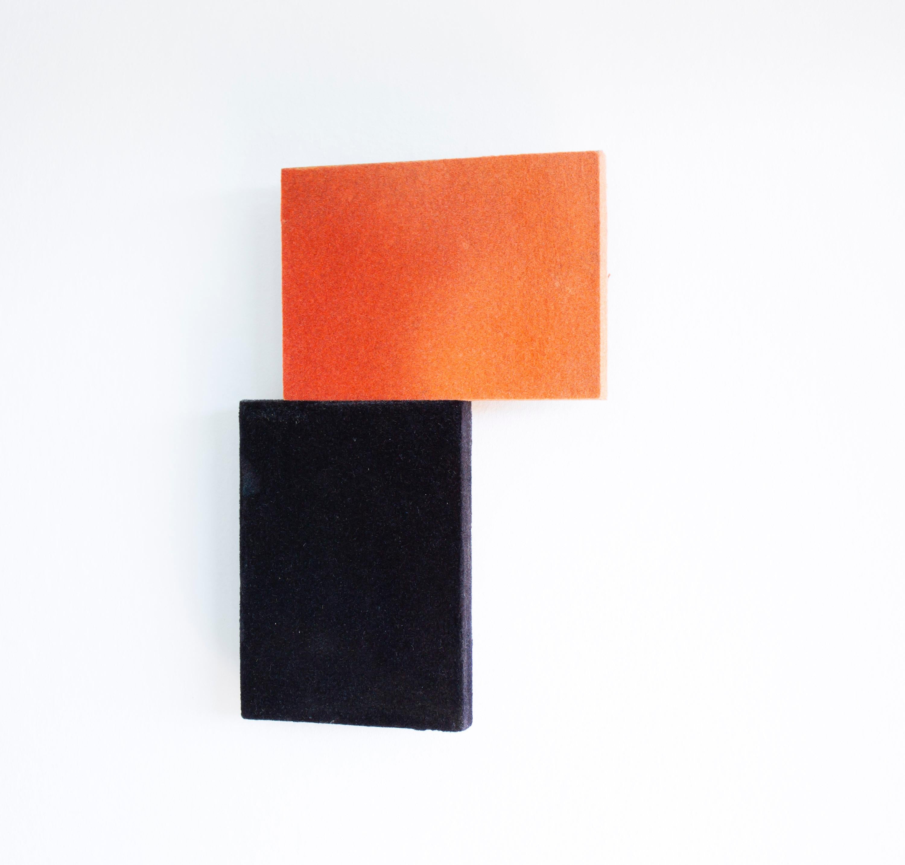 «Red on black» wall relief by Hanne Øverland. 

intriguing and highly decorative wall relief. A red rectangle balances on the edge of a standing, black rectangle.  