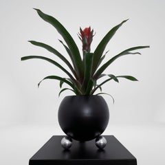 Arty decorative hand-made plant pot, black with silver legs