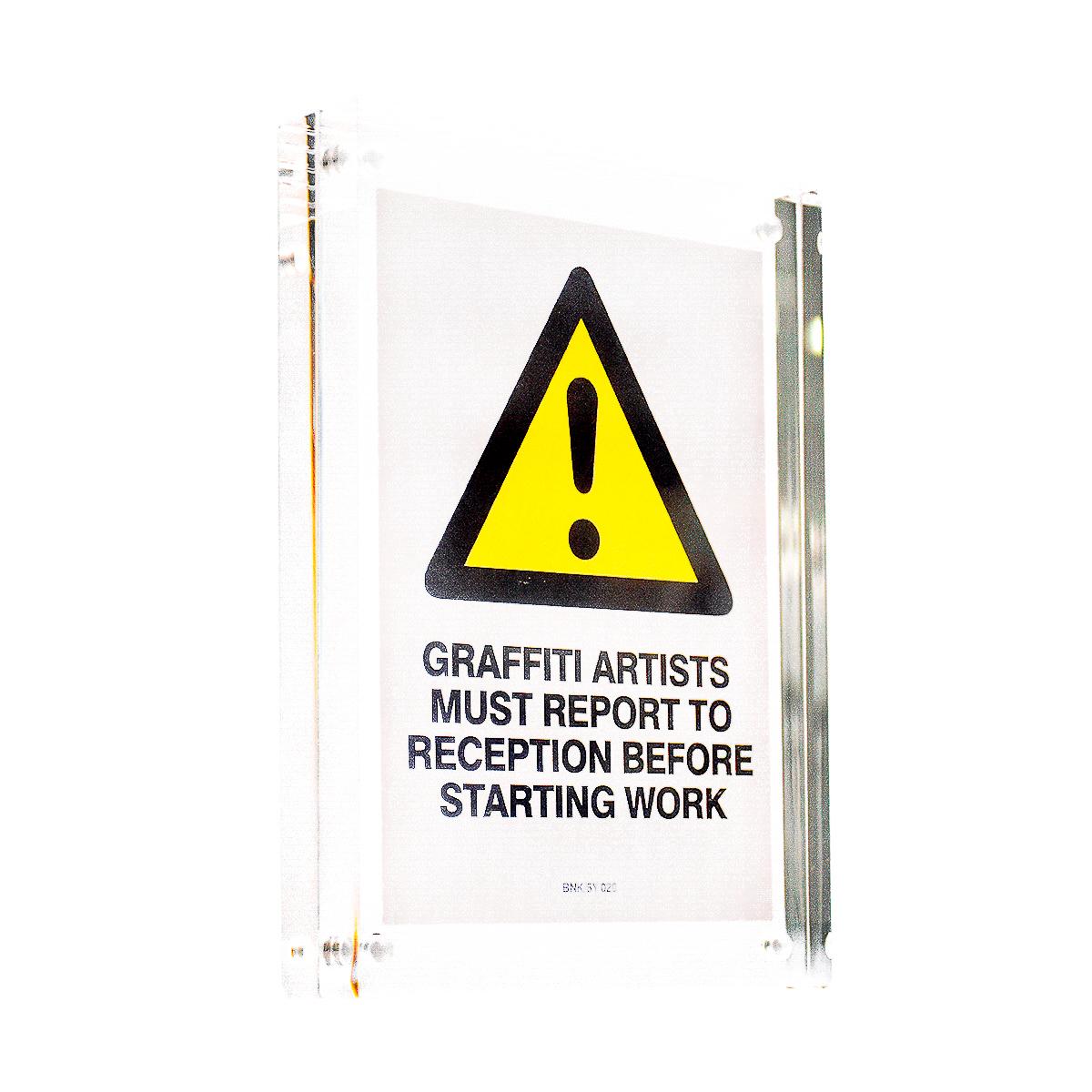 BANKSY GRAFFITI ARTISTS MUST REPORT TO RECEPTION BNK/5Y 020 STICKER (Framed) - Art by Banksy