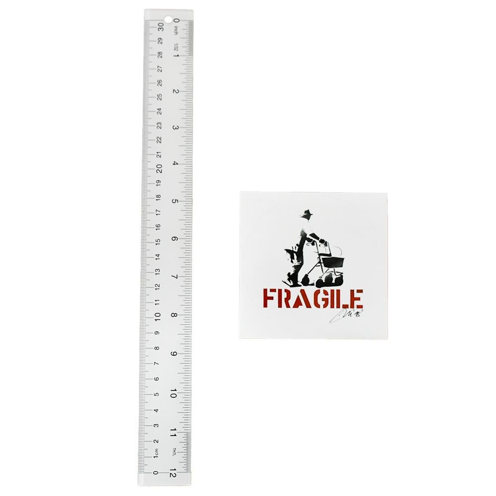 Rare example of hand signed Fragile Sticker.
Hand signed by Kunstrasen on front of sticker in black ink.
Round sticker on square cut paper.
Comes float framed (not stuck) in clear acrylic block frame.






RELATED:
Invader, KAWS, Banksy, Shepard